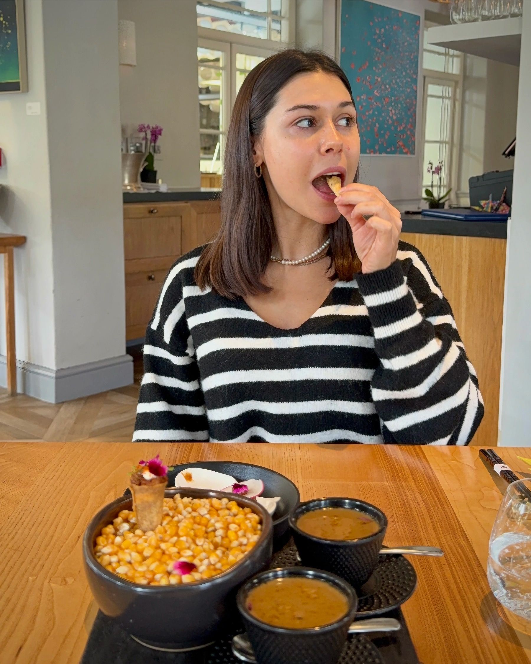 Paige tasting amuse-bouche during Oku tasting menu.