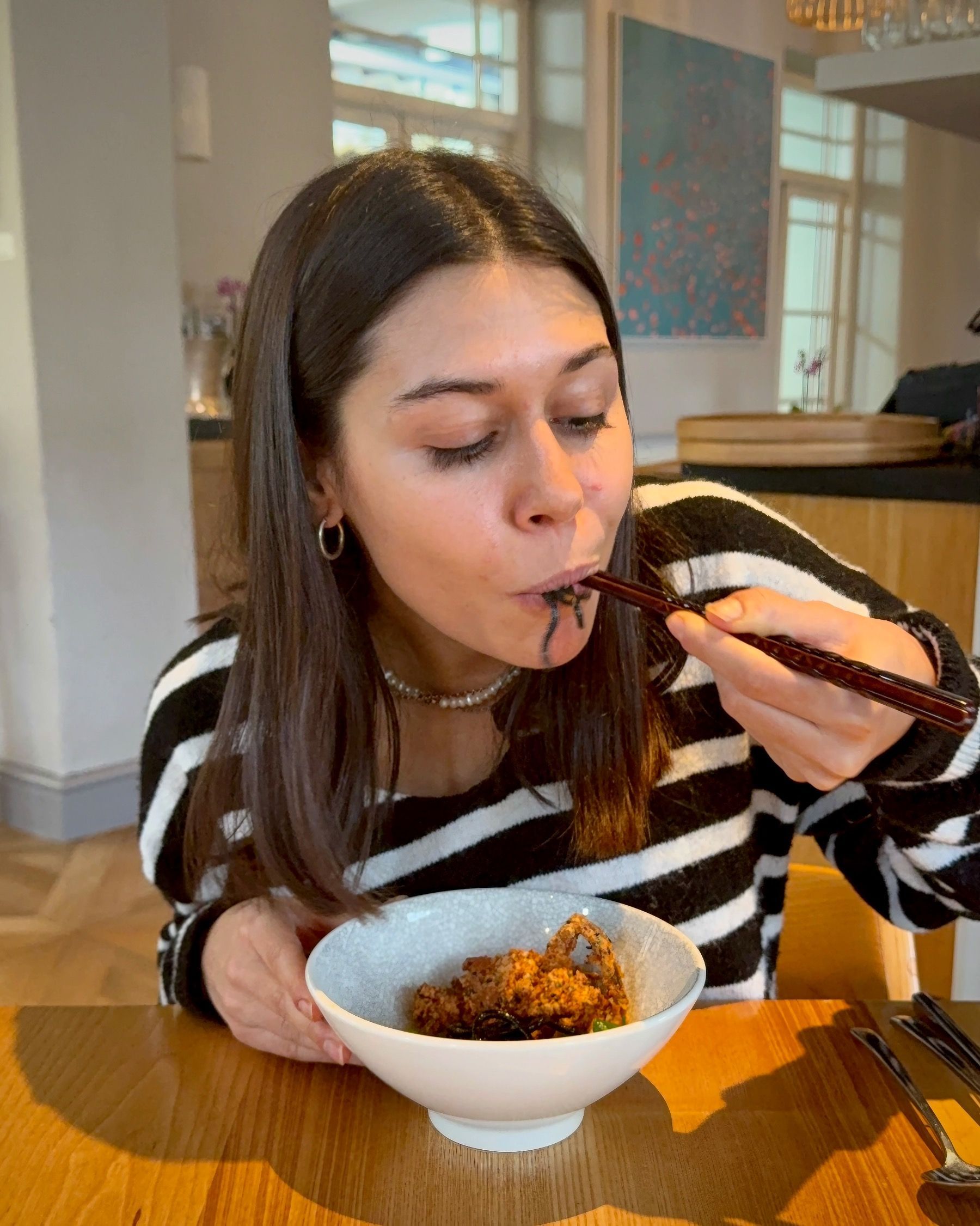 Paige enjoying soft shell crab course at Oku Franschhoek.