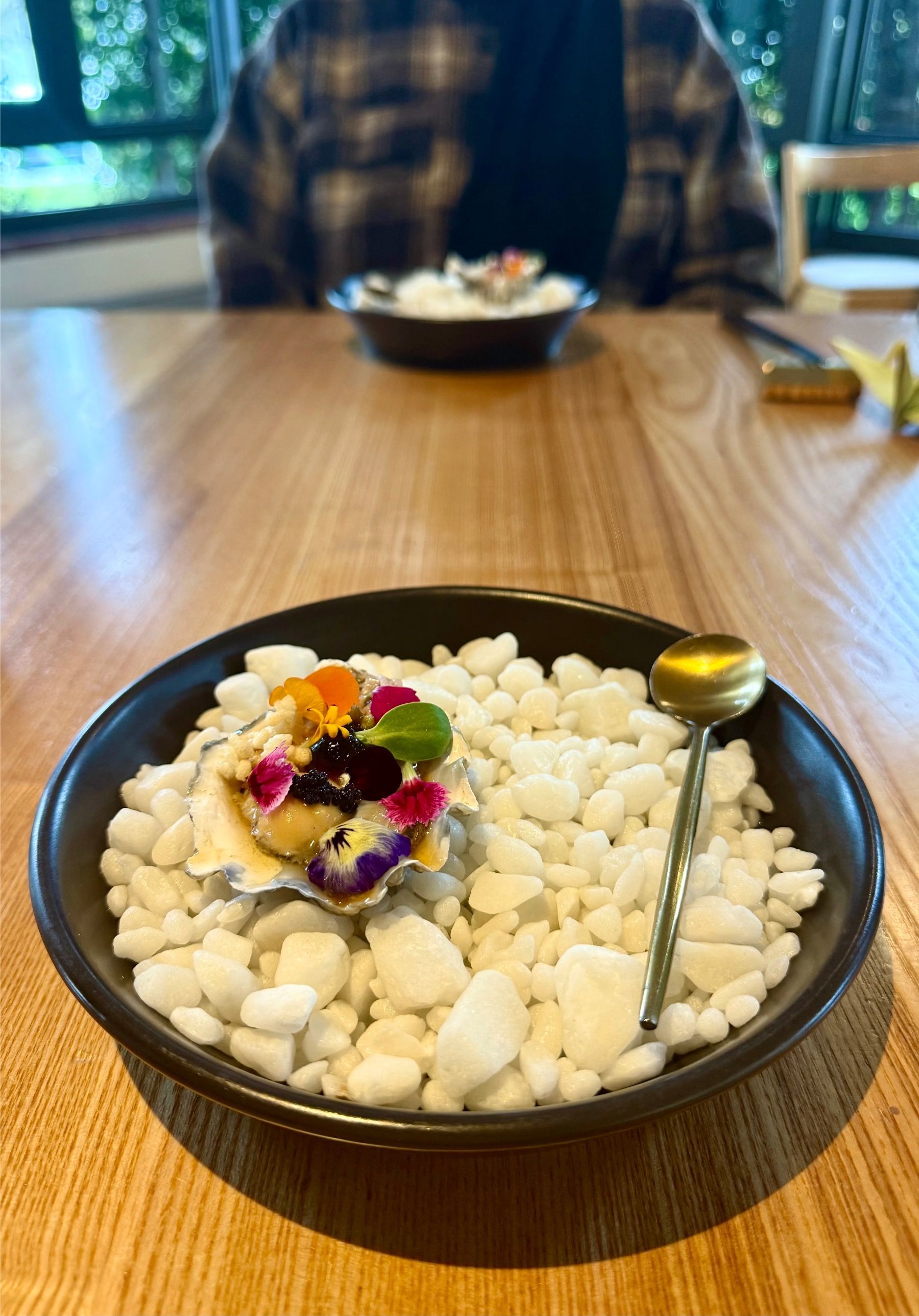 Fresh oyster with refined garnish served in elegant Kaiseki style.
