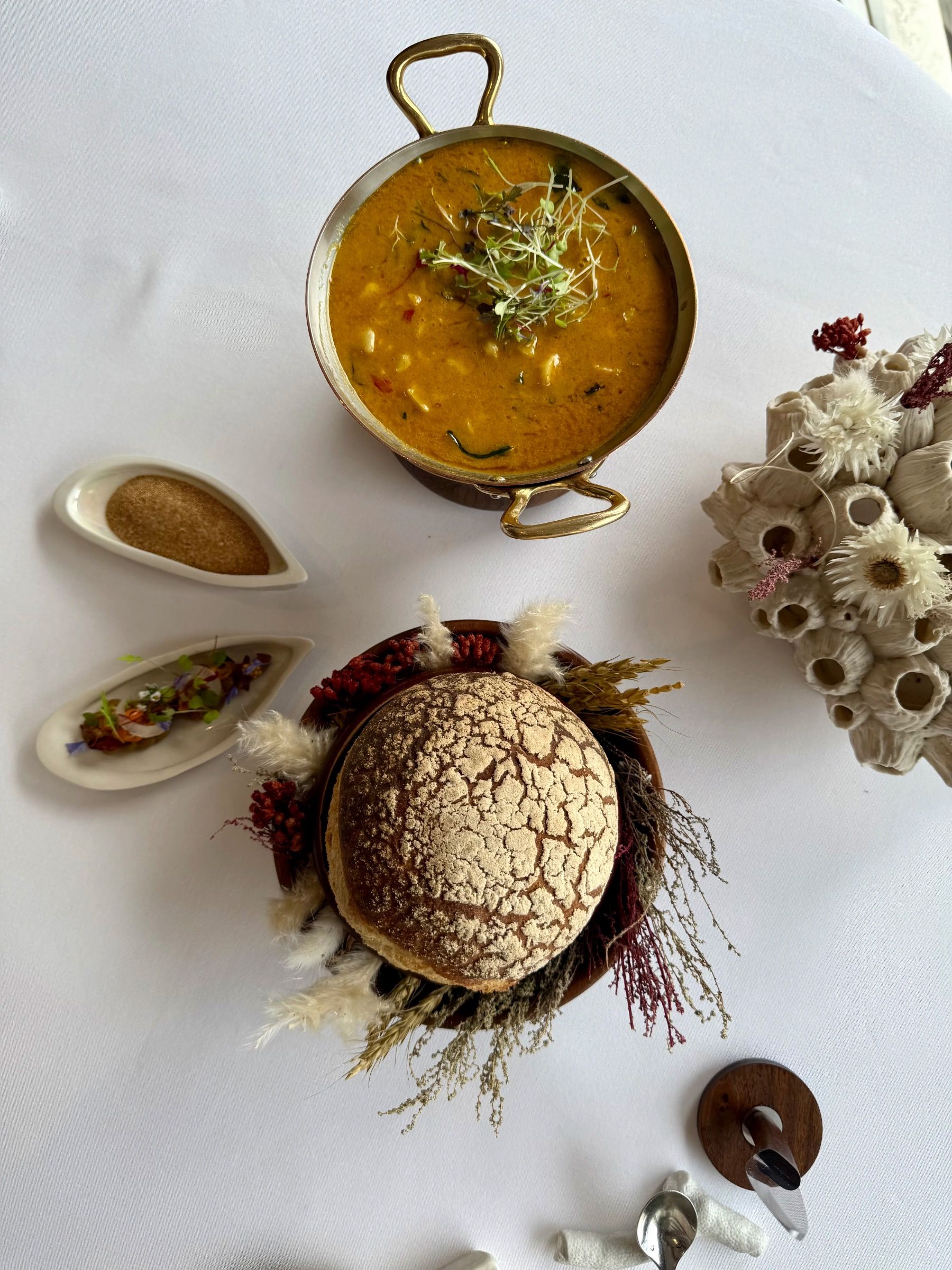 Curried hake bread course with cultured butter at Pier Restaurant
