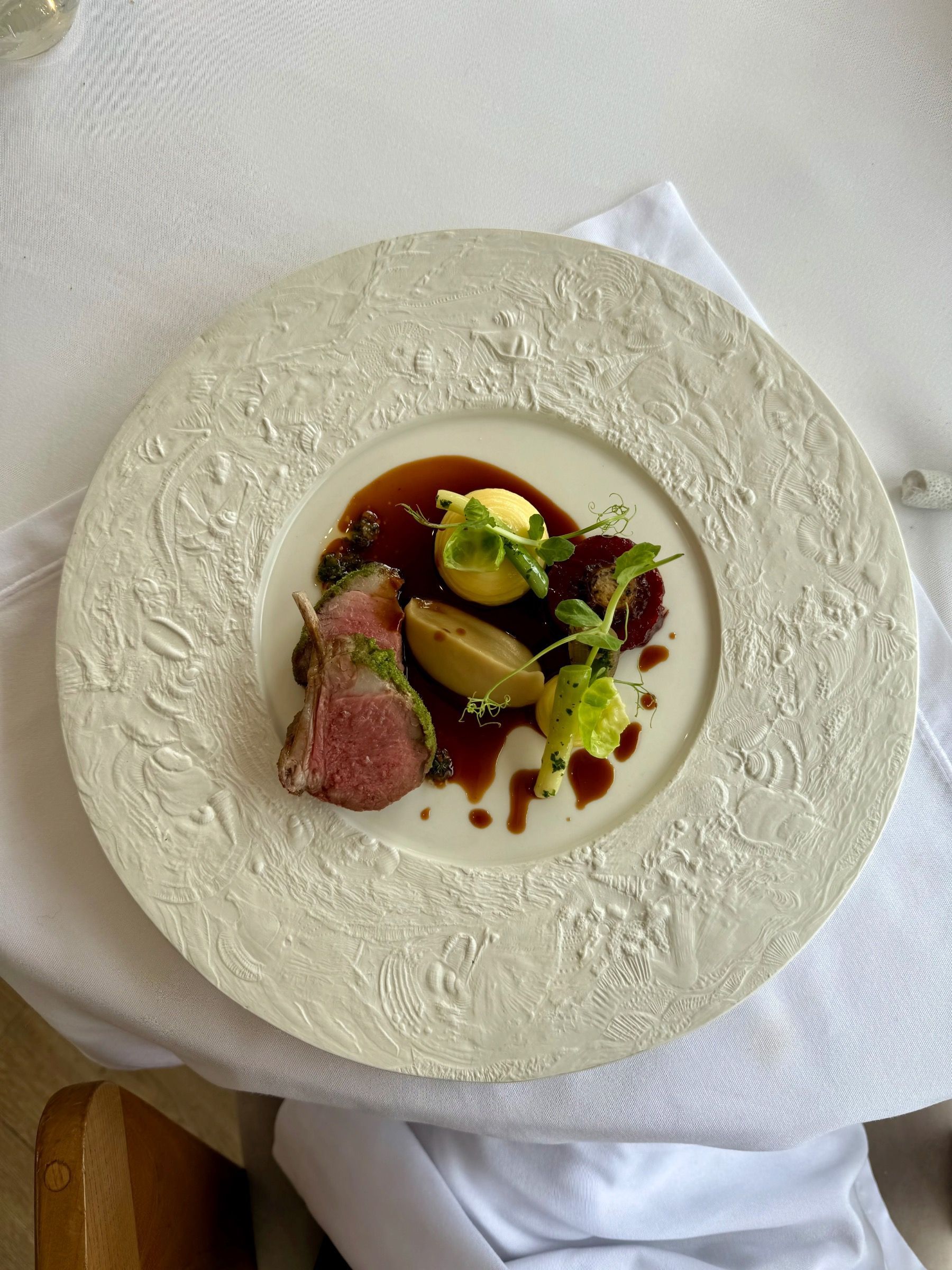 Herb-crusted lamb main course at Pier Restaurant Cape Town
