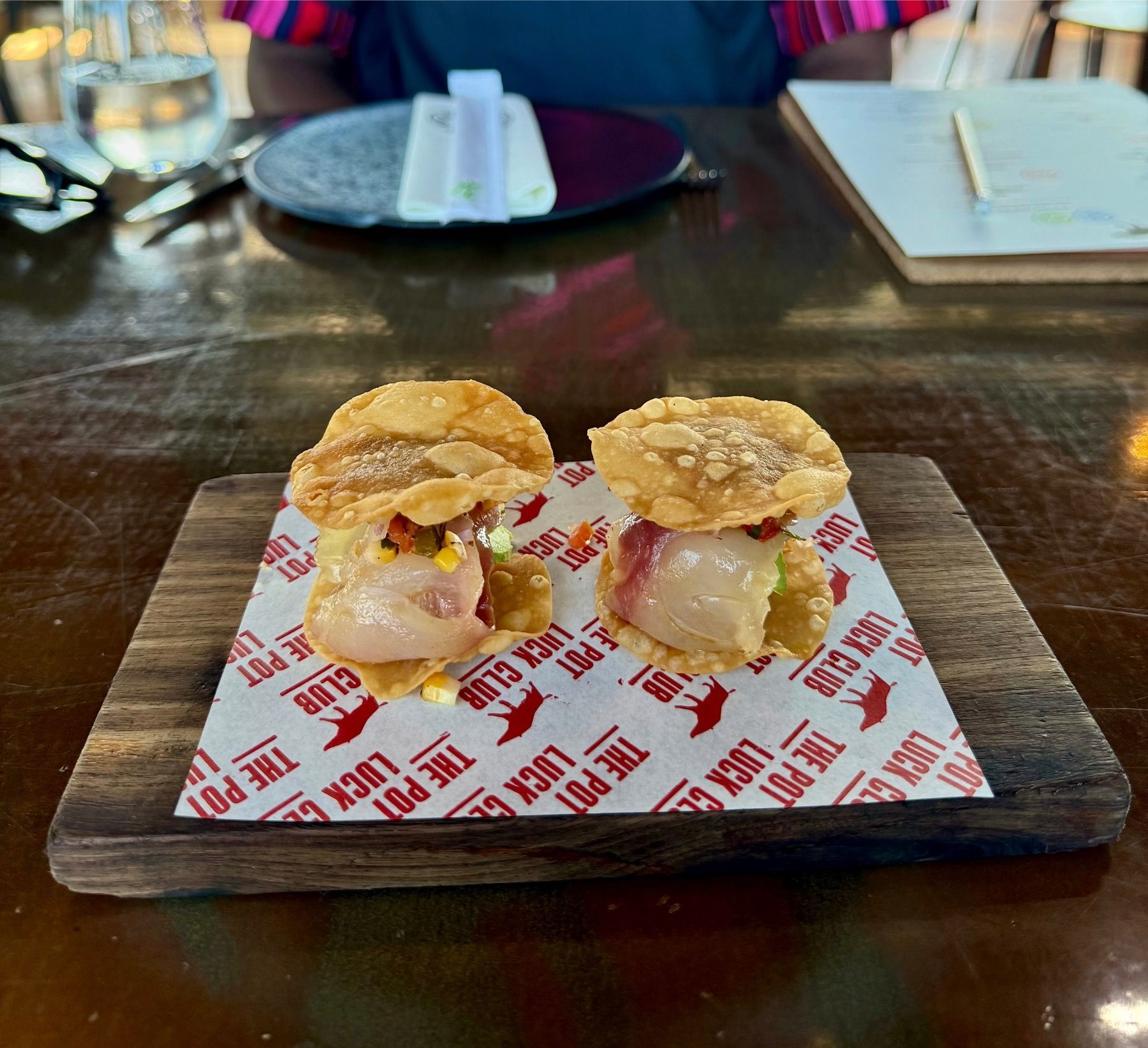Fish Tacos 2.0 at Pot Luck Club with crispy fish, salsa and fresh herbs

