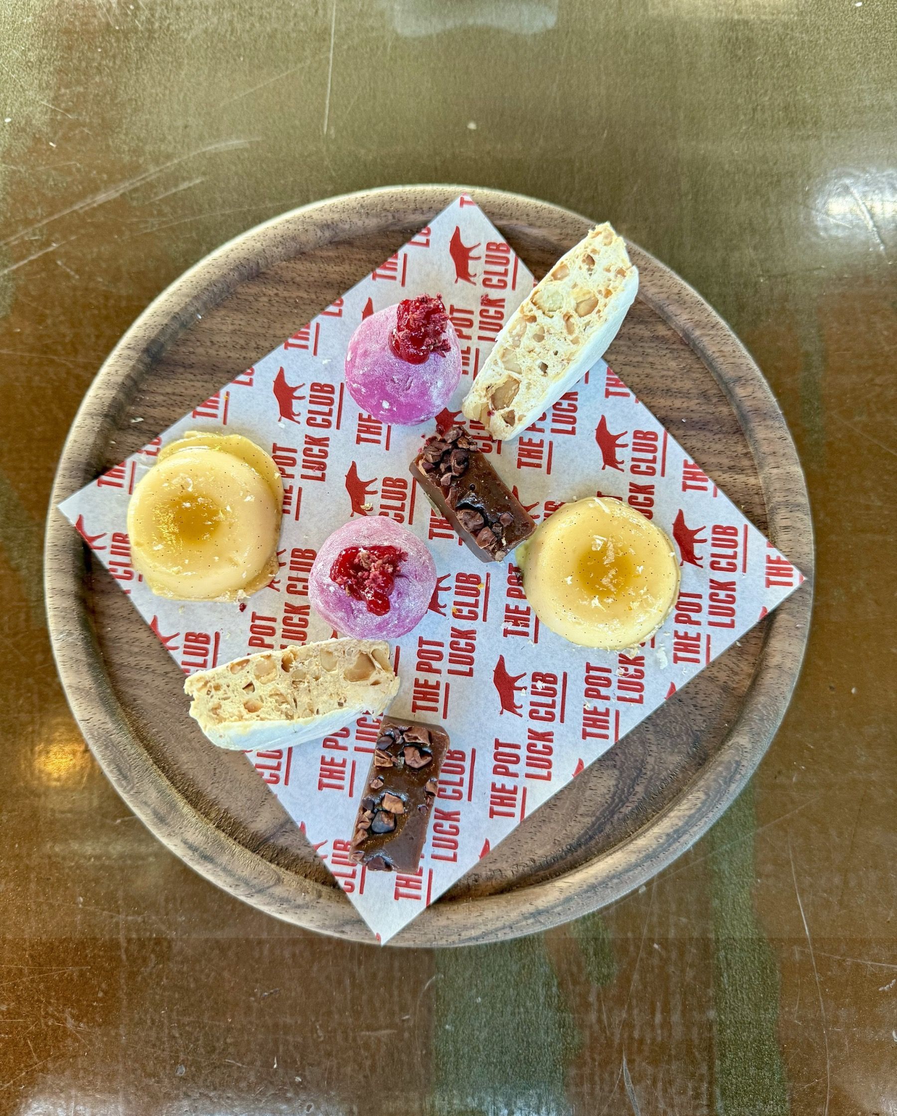 Pot Luck Club dessert selection including nougat, chocolate caramel, tropical bomb and strawberry mochi