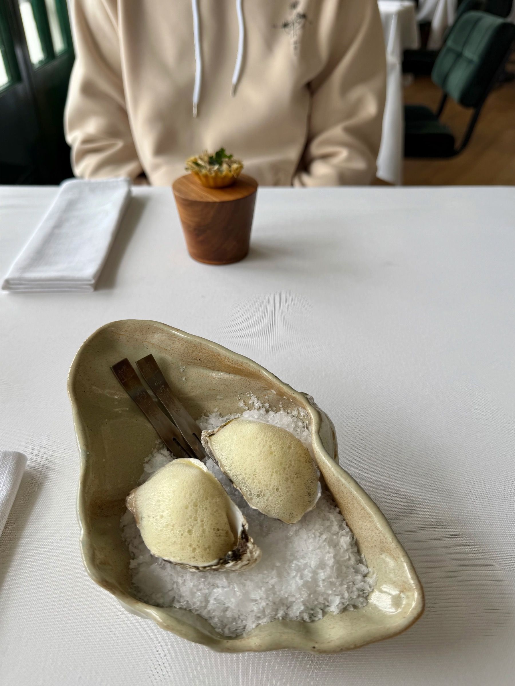 Roasted oyster with refined garnish at Salsify Camps Bay