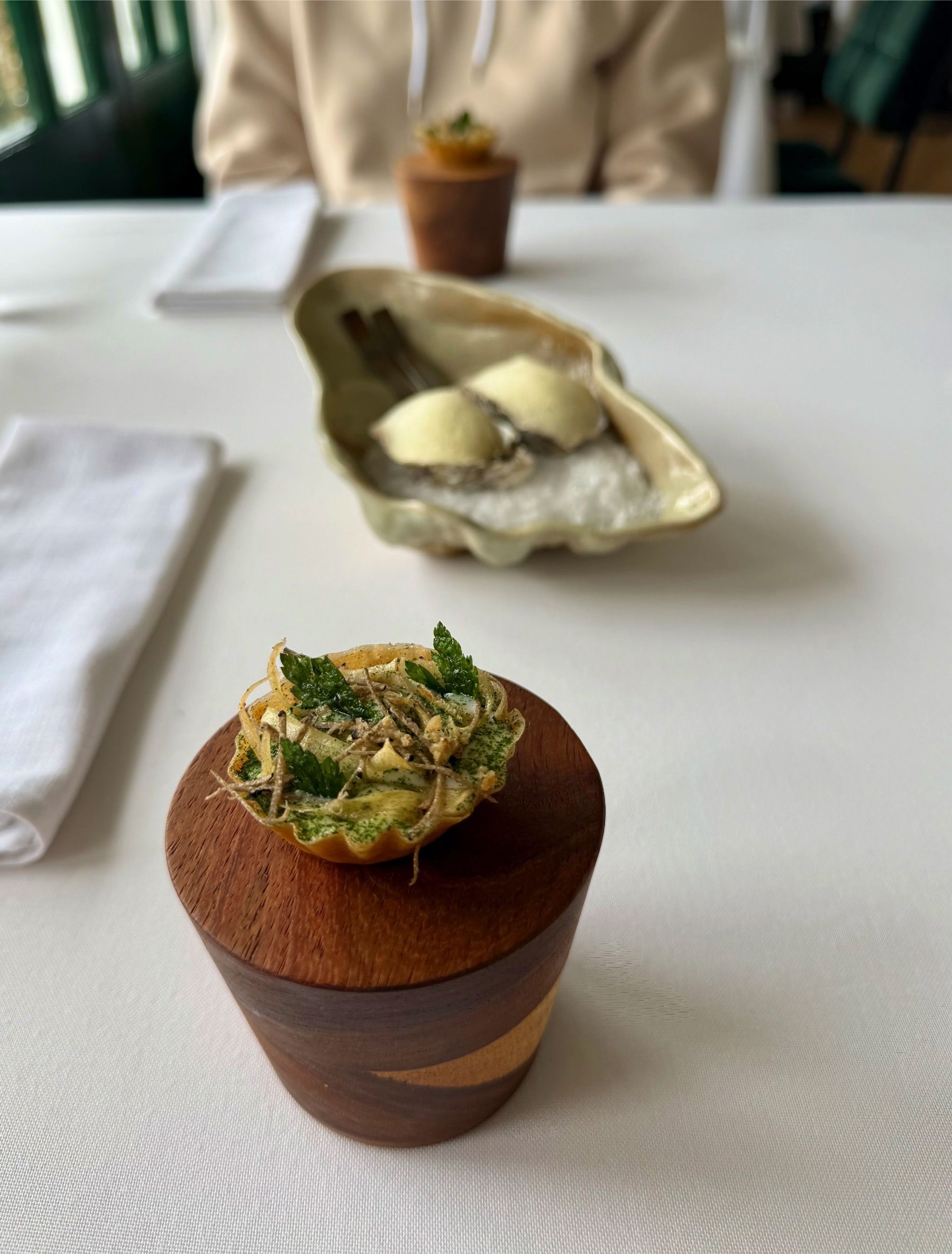 Chicken skin tart with delicate garnish at Salsify