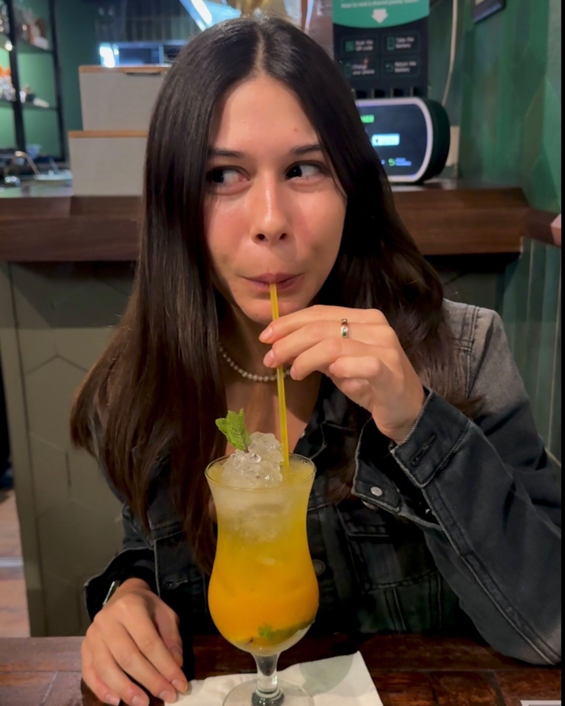 Paige is drinking a mango mojito at Sundoo Sea Point