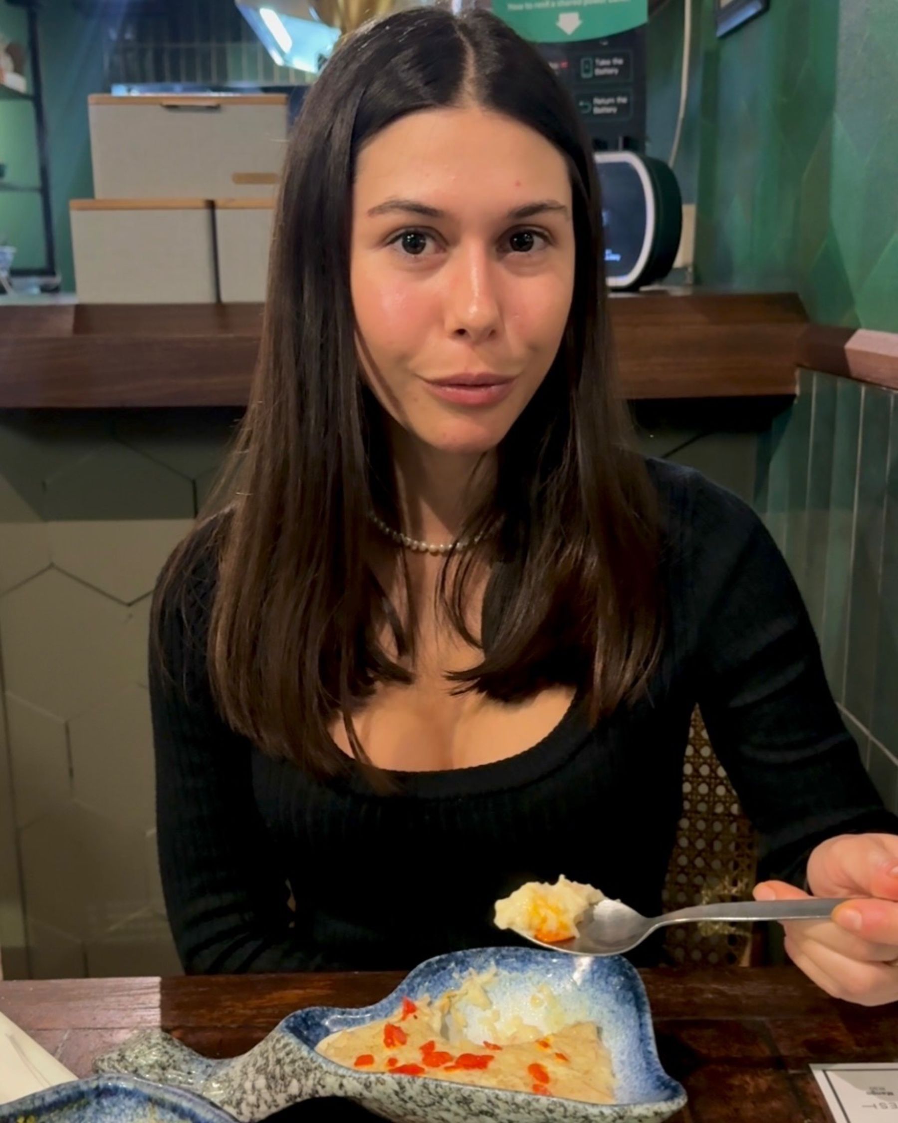 Paige is eating vermicelli rice pudding at Sundoo Sea Point
