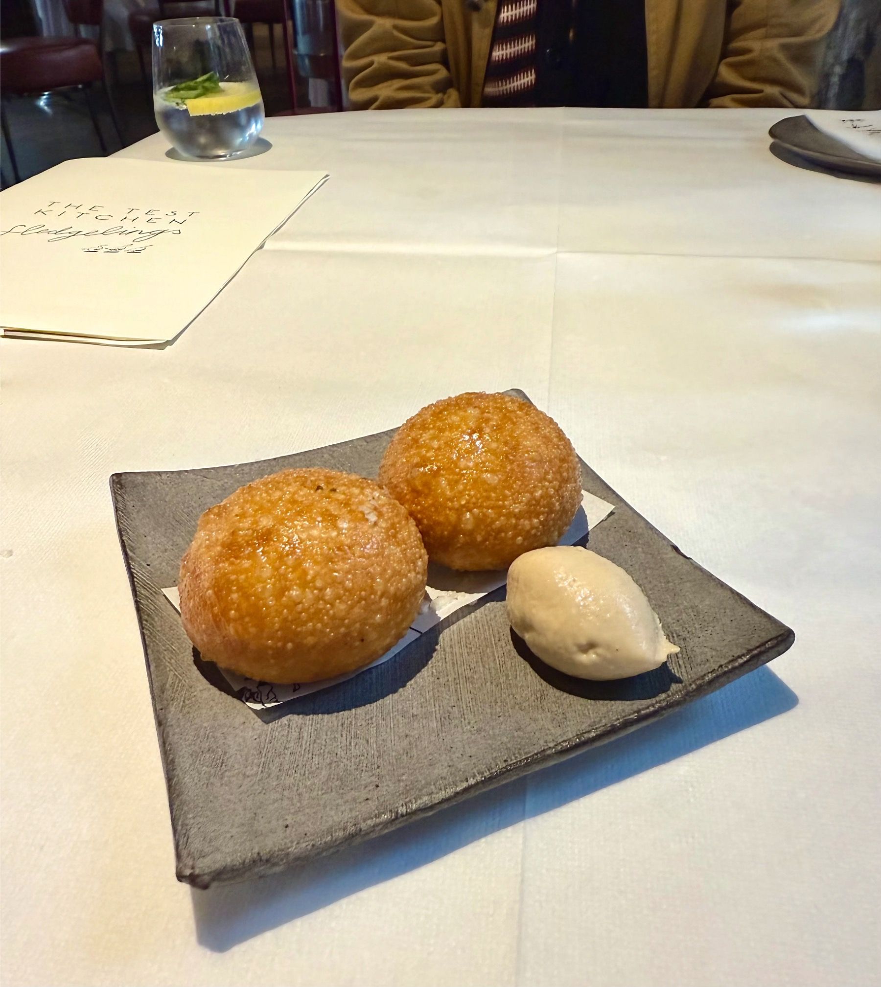 Golden vetkoek with smoky snoek pâté and cultured butter at The Test Kitchen