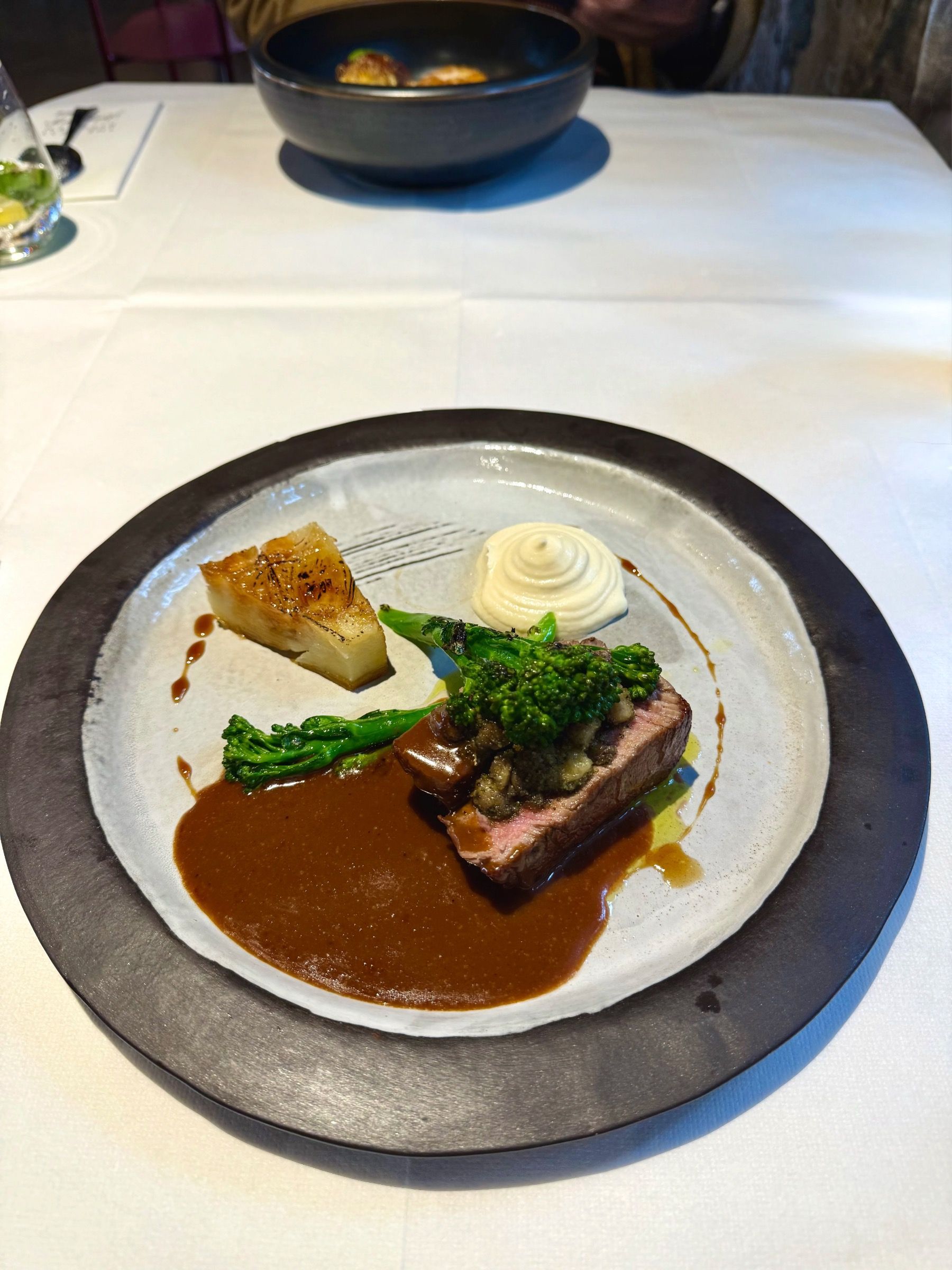 Beef fillet with signature sauce and seasonal garnish at The Test Kitchen
