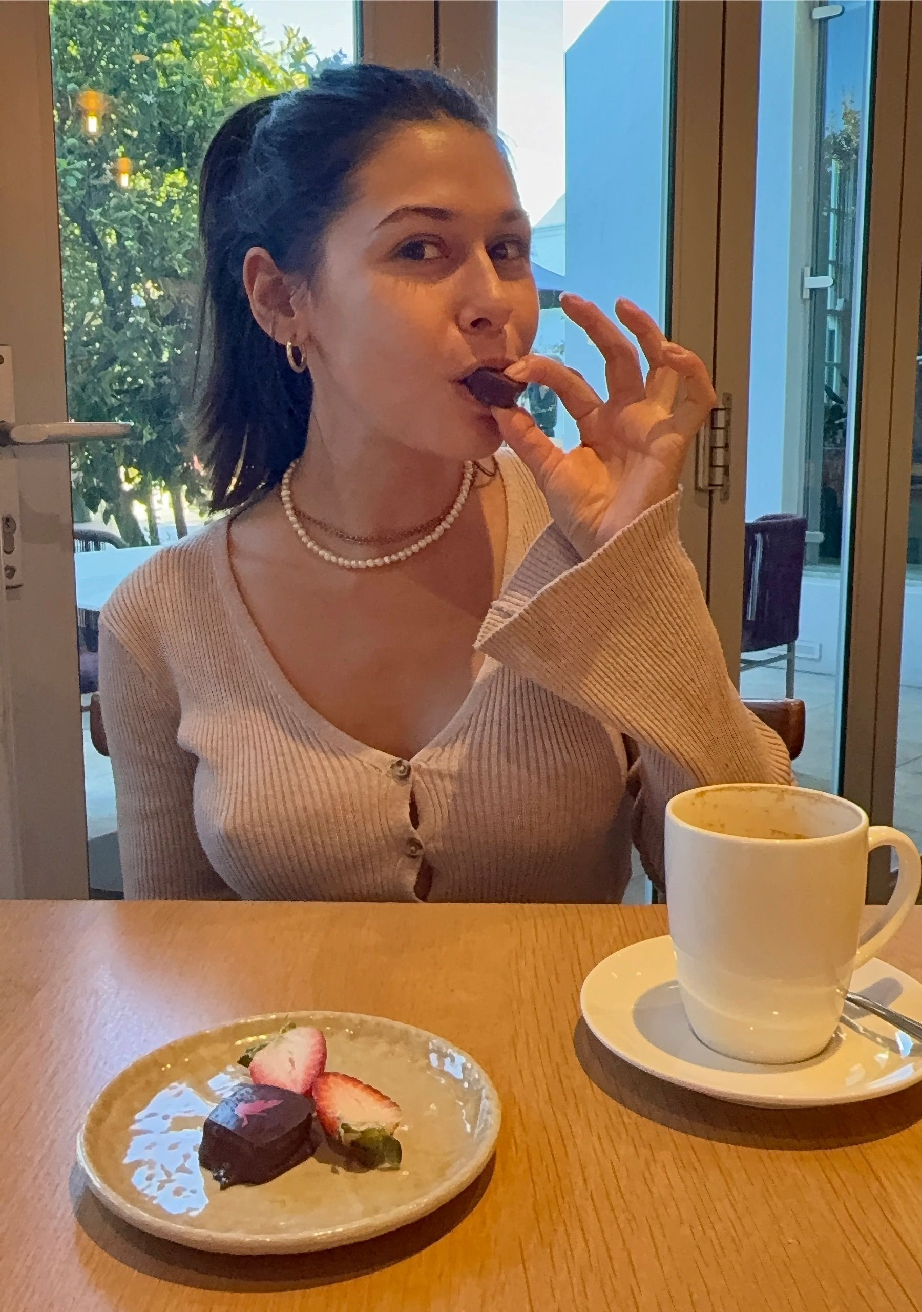 Paige tasting chocolate truffle at Tryn restaurant