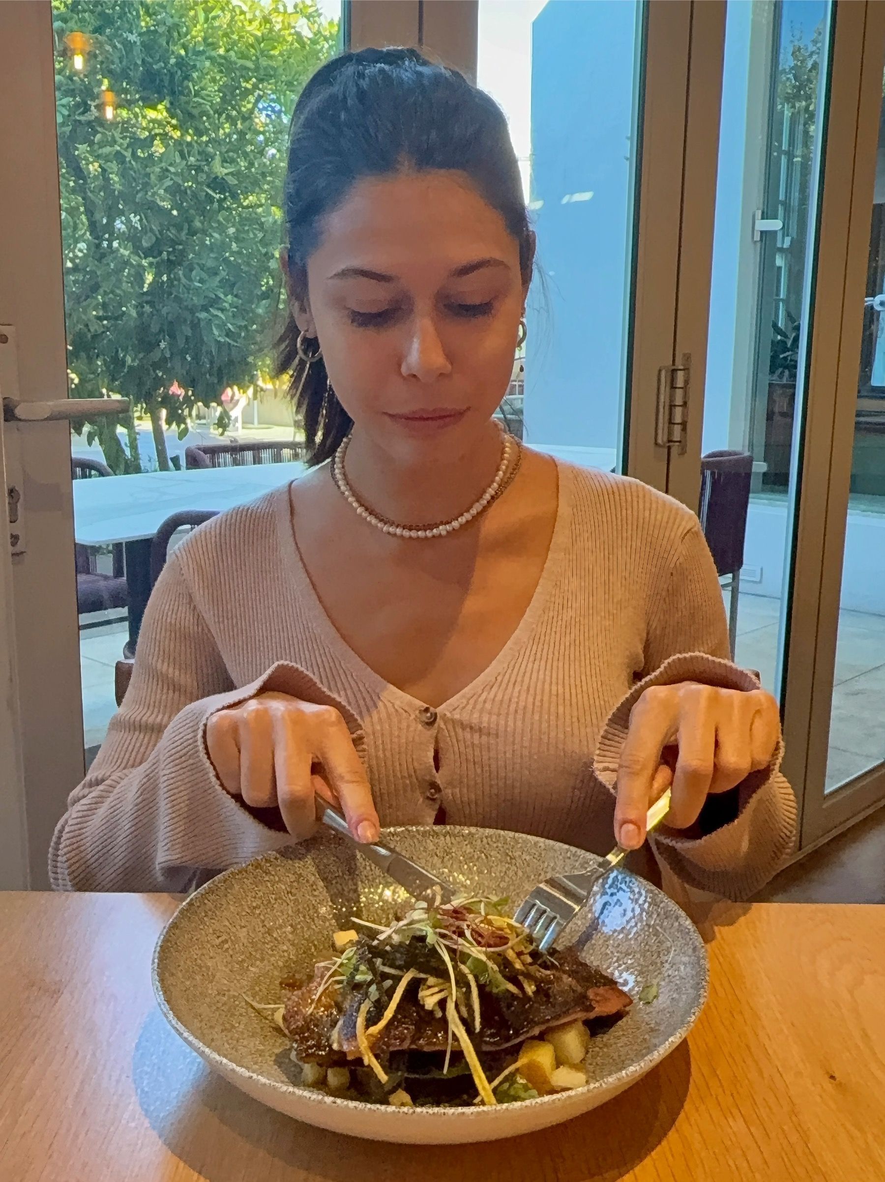 Paige enjoying seafood main course at Tryn