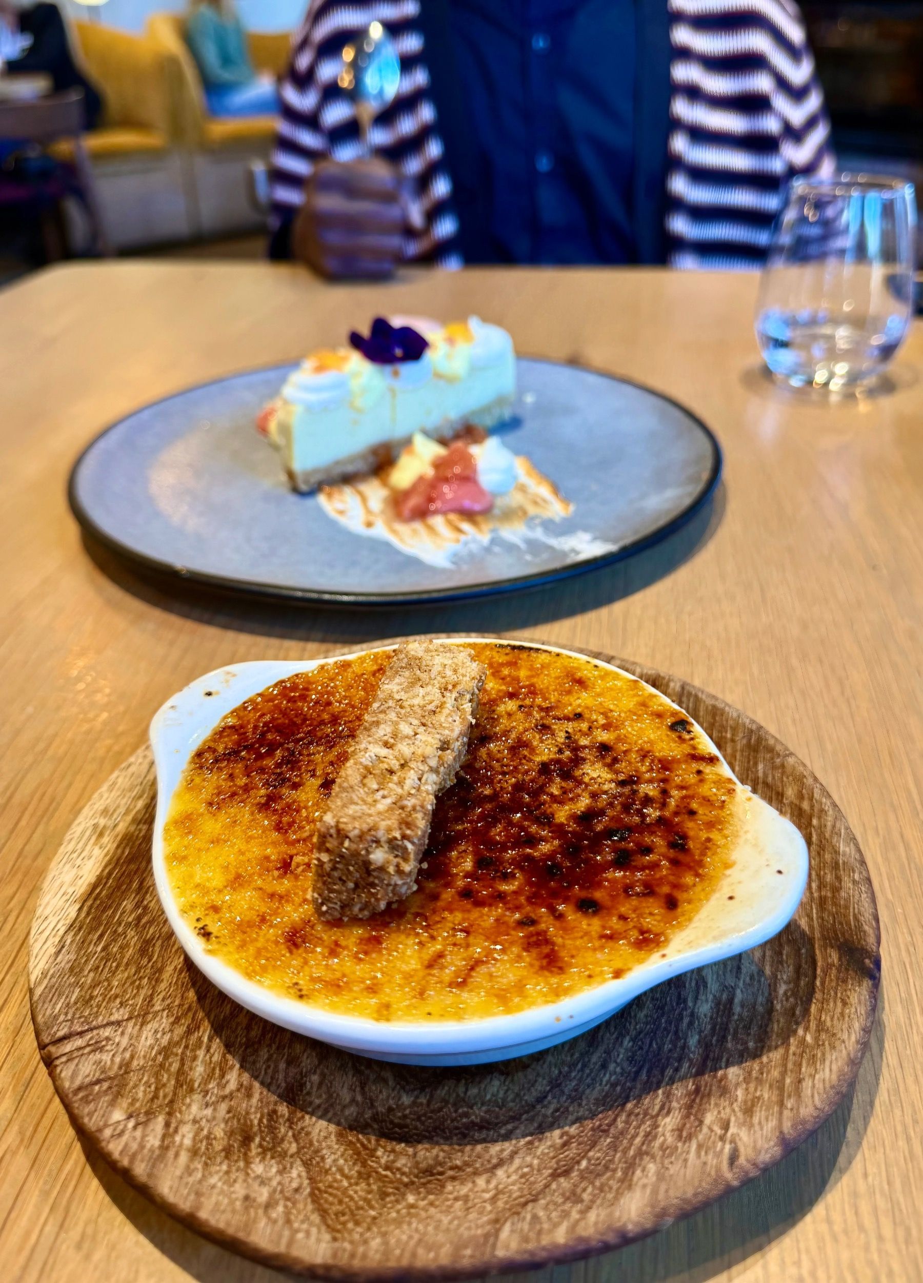Clementine and chai crème brûlée with biscuit on top at Tryn Cape Town
