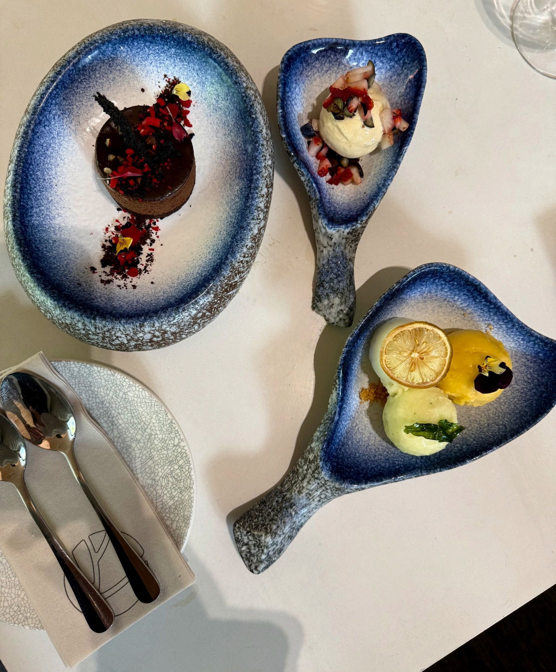 Desserts at Urban Umami, featuring rich chocolate mud pie and mango, lemon, and pineapple basil sorbets.