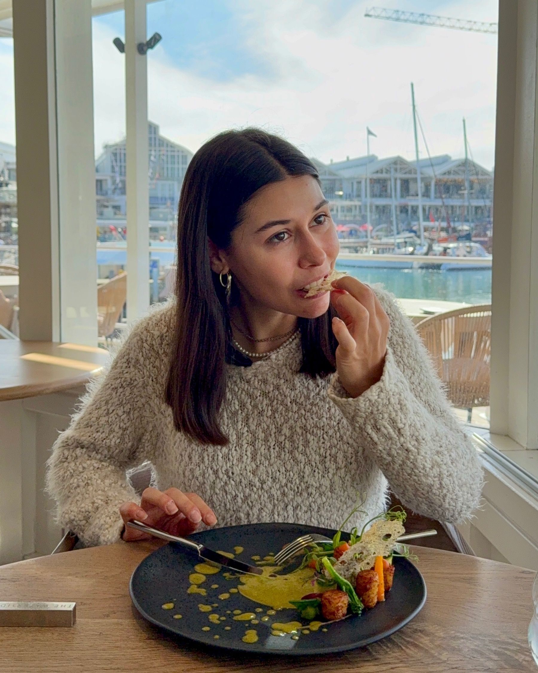 Paige eating the gnocchi main course during lunch at The Waterside.
