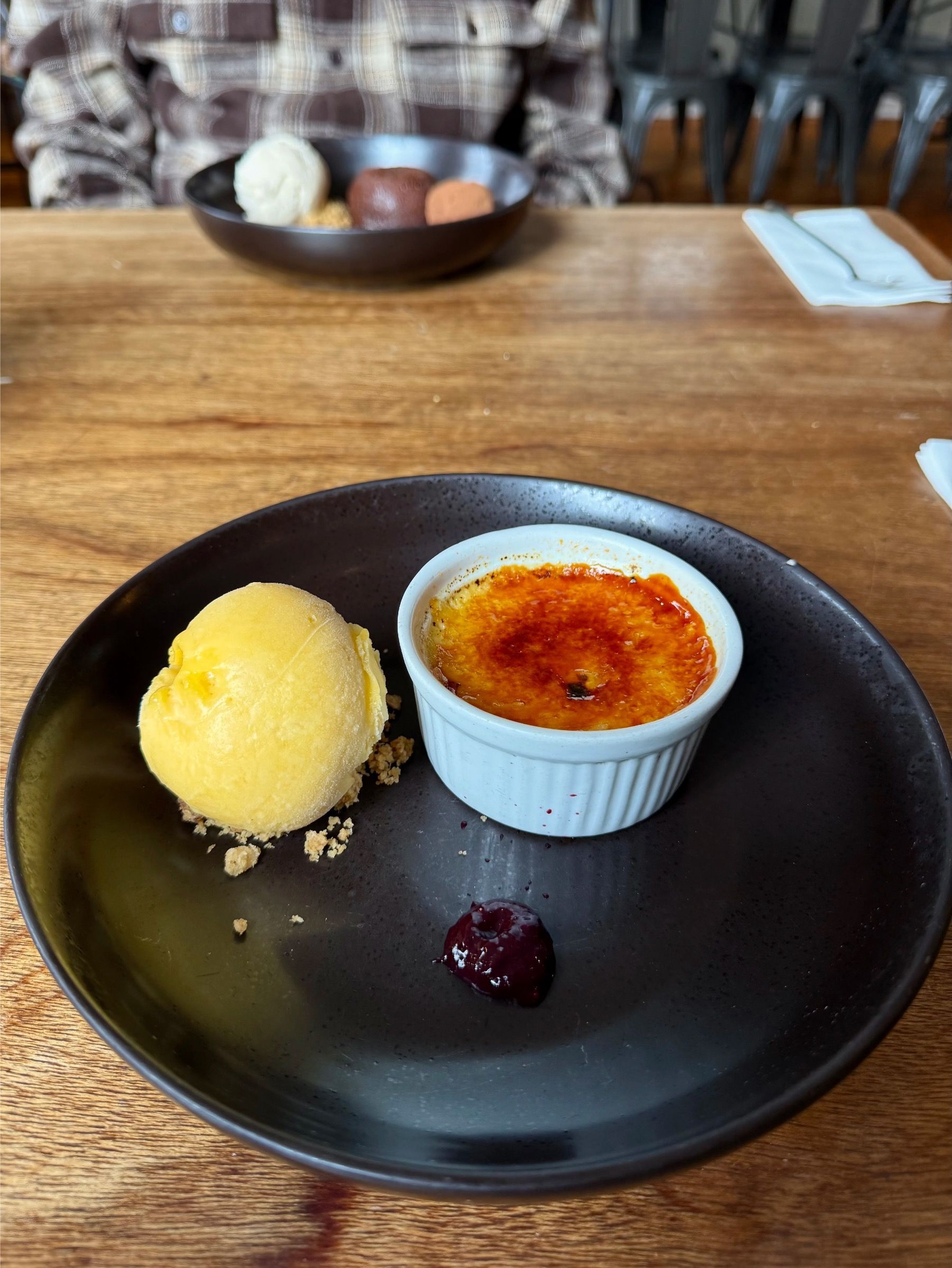 Crème brûlée dessert with golden caramelised sugar top served at Woodlands Eatery in Cape Town
