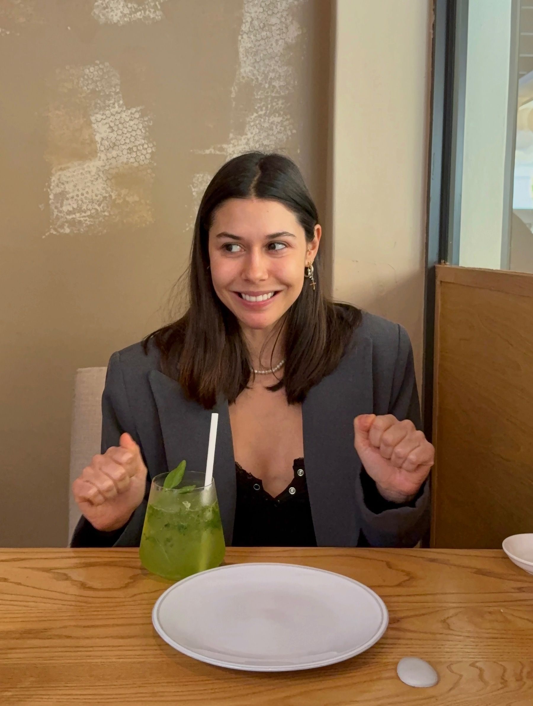 Paige sipping green basil cocktail at Yama Asian restaurant Cape Town
