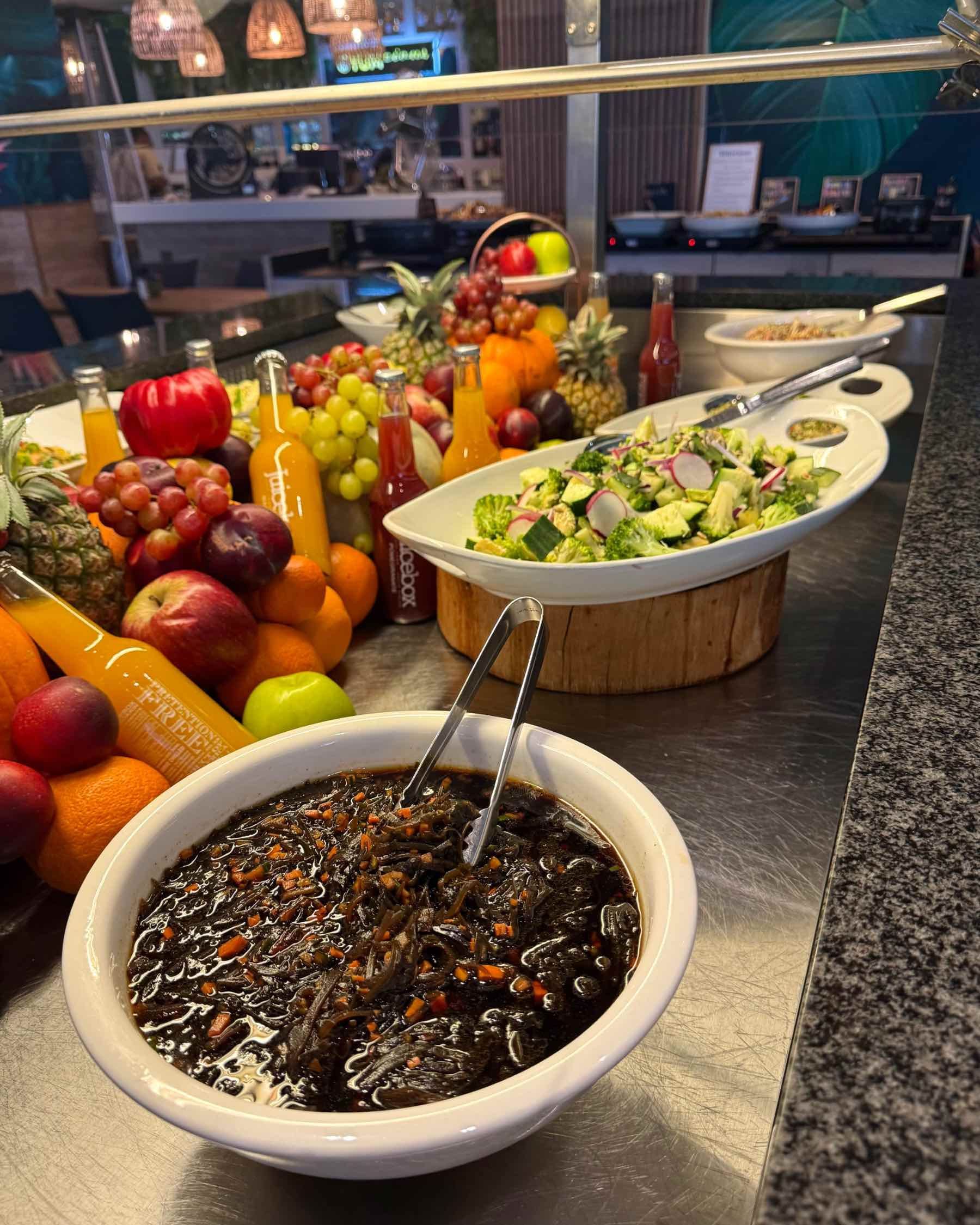 Close-up of vibrant seasonal salads at Yumcious Cape Quarter Harvest Table, Cape Town.