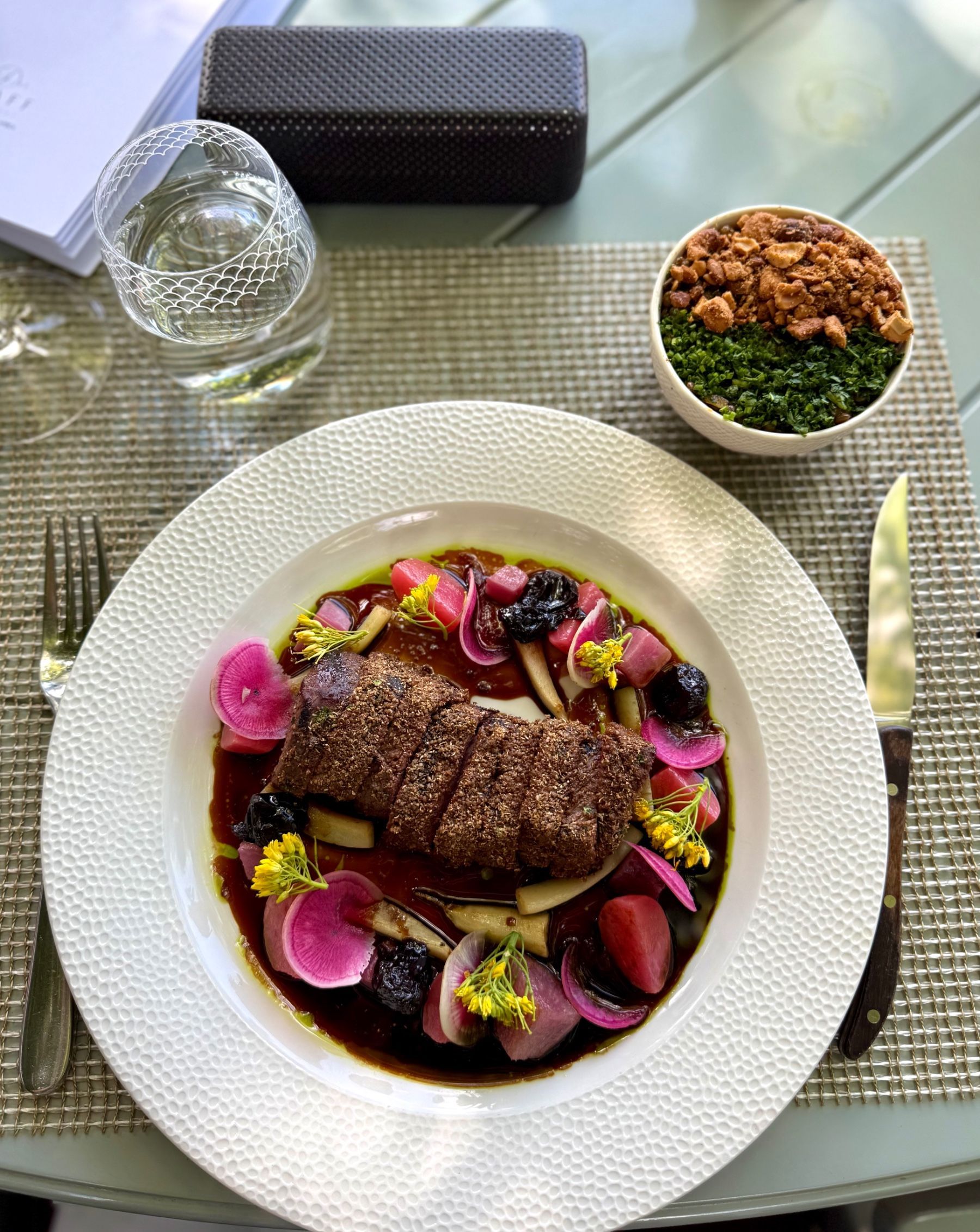 Coriander crusted venison loin with Cape Malay lentil salad at Delaire Graff Wine Estate
