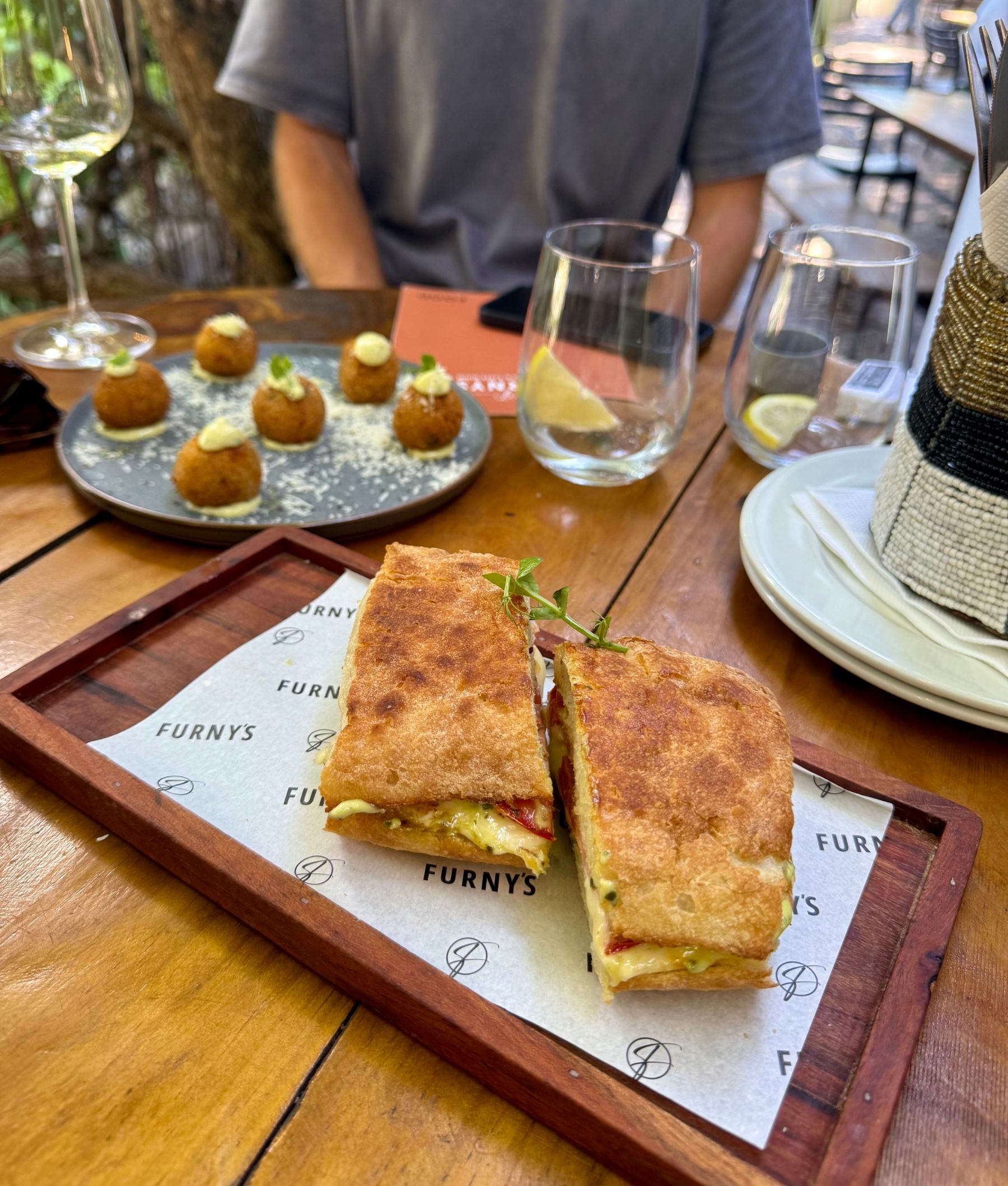 Furney’s Wine Bar truffle arancini and mozzarella pesto tomato toasted sandwich
