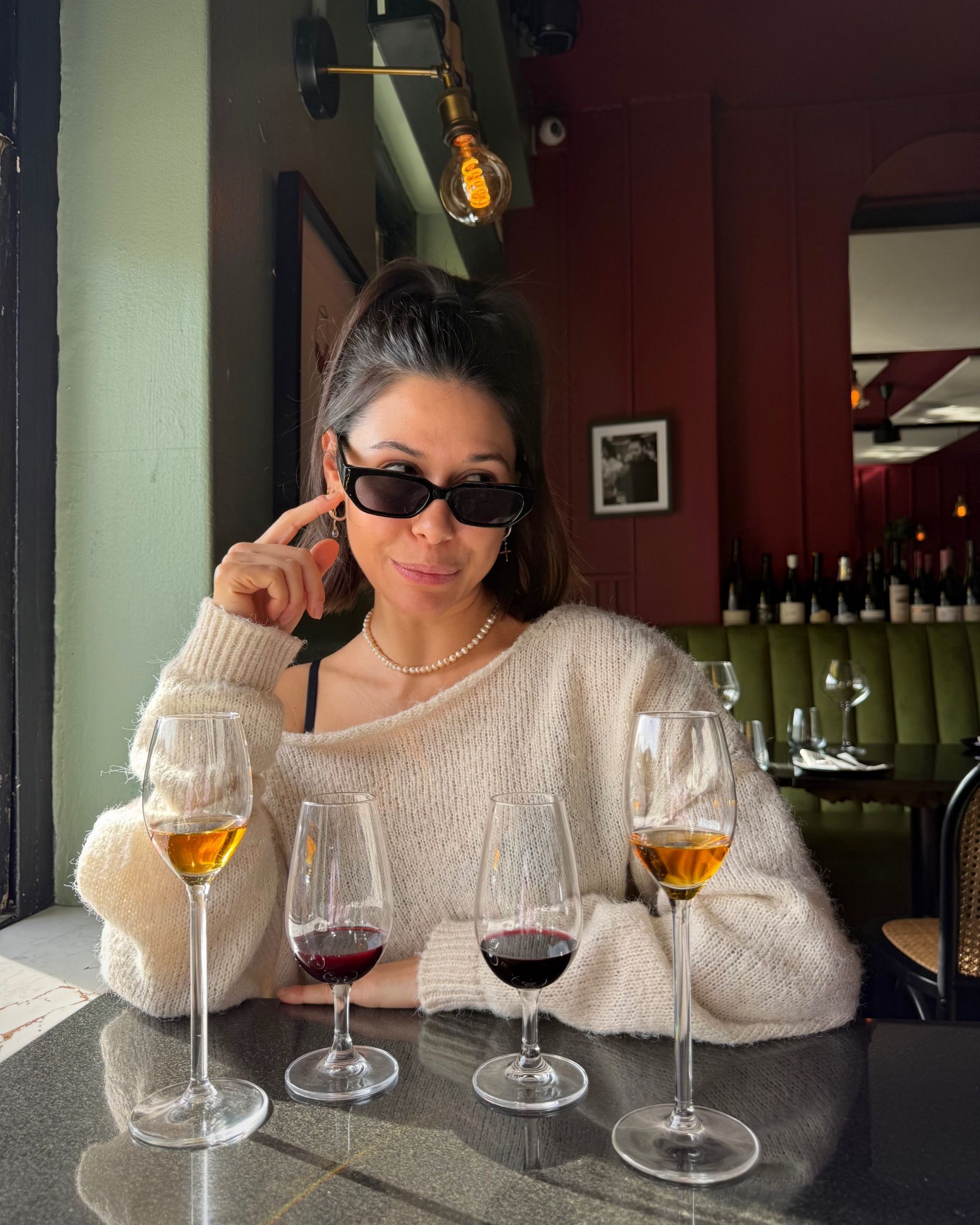 Paige sipping a Negroni while dining at Massimo’s.