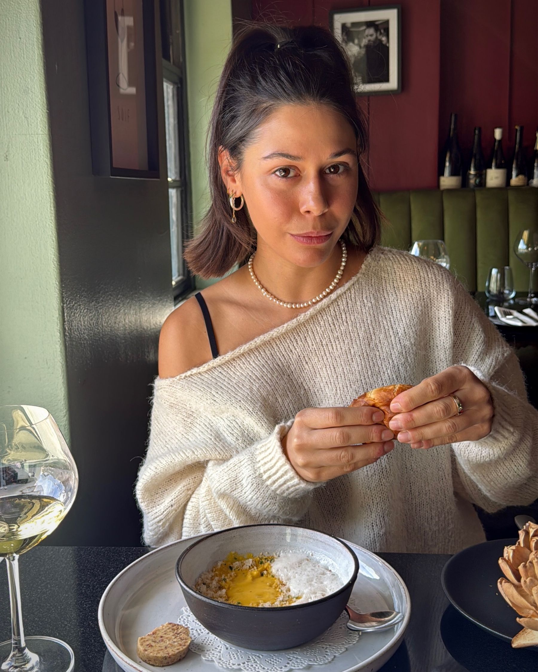 Paige enjoying the vegan cauliflower dish.