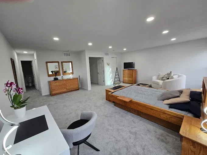 There is a large bed in the middle of the room.