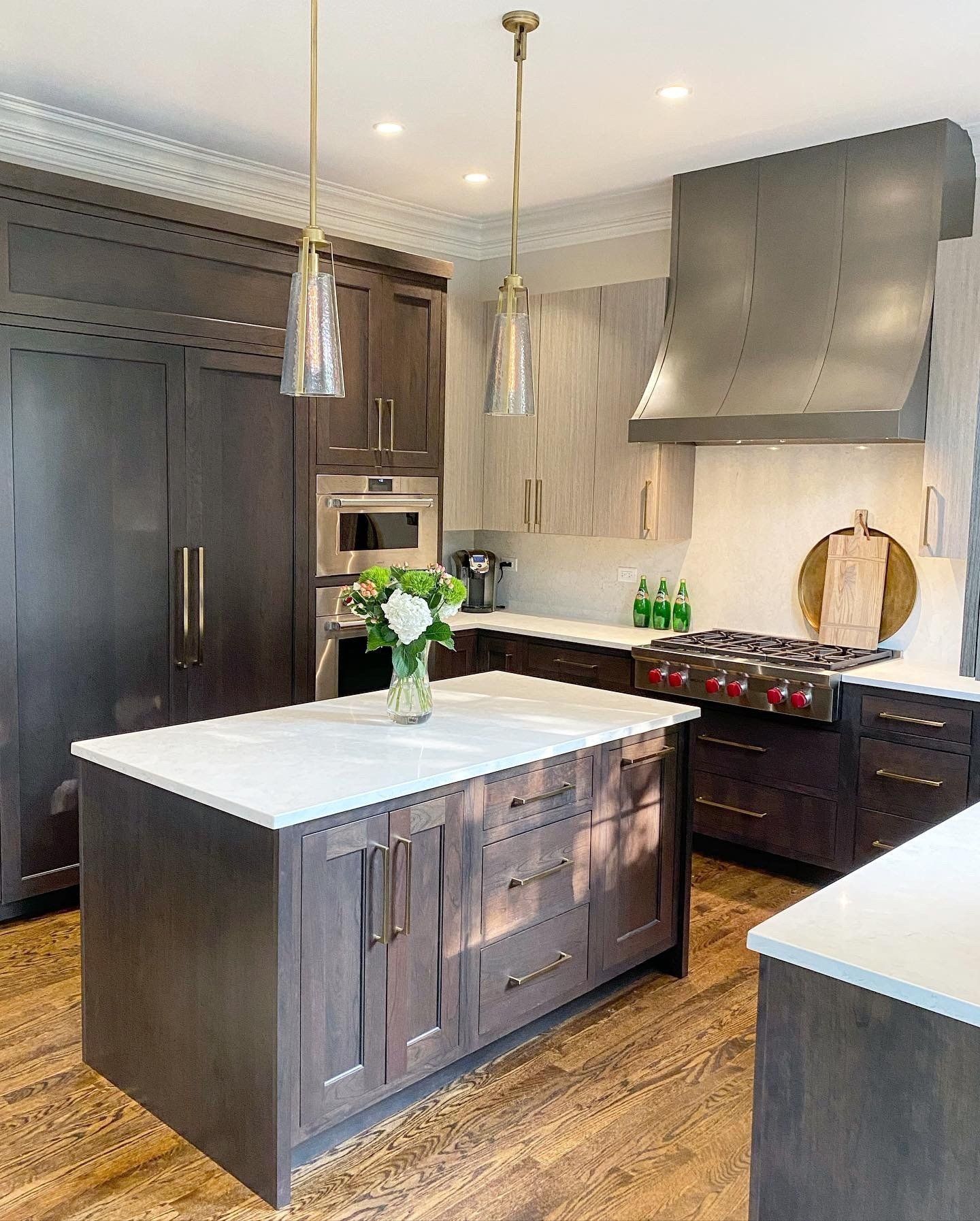 There is a large island in the middle of the kitchen.