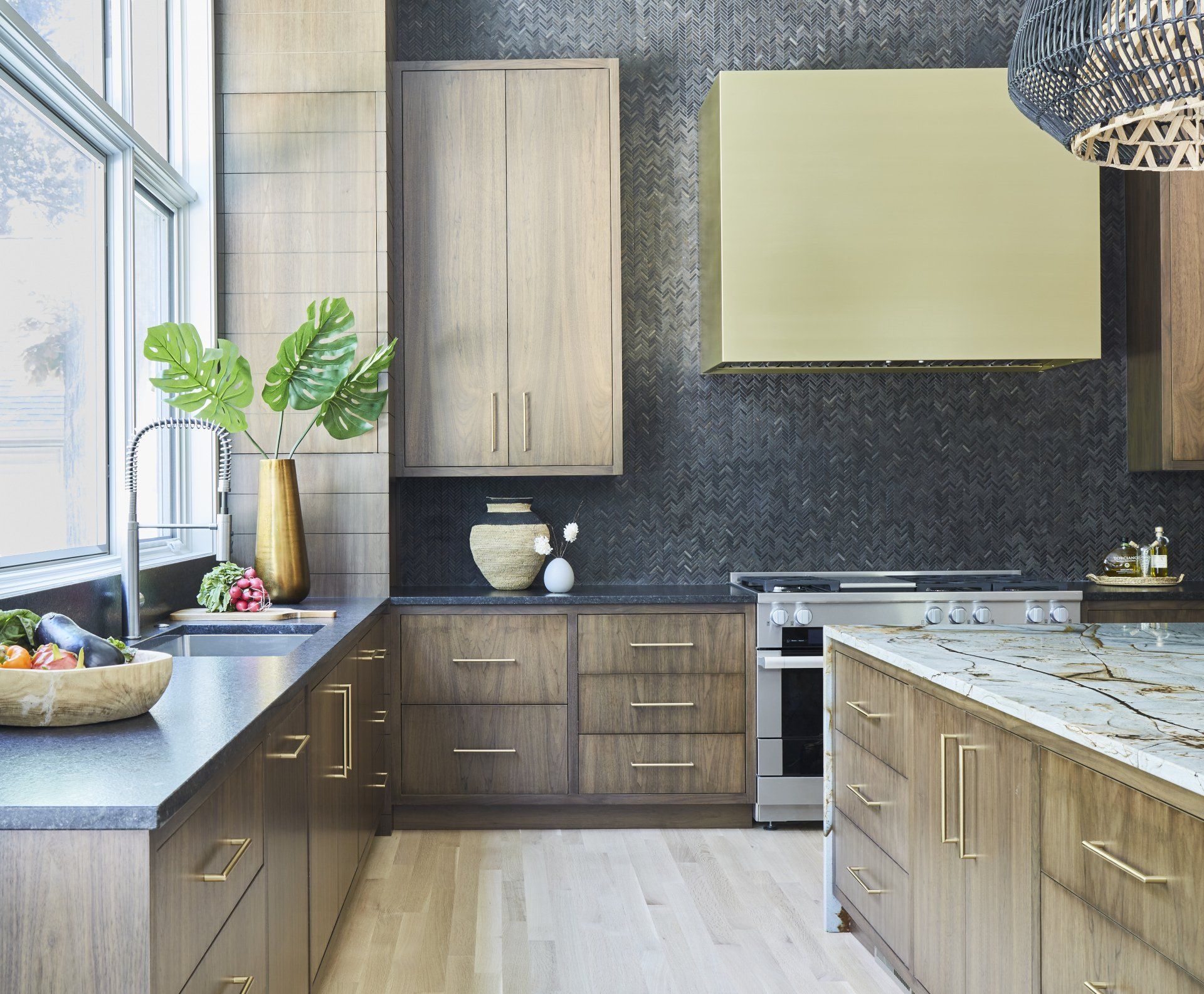 A kitchen with stainless steel appliances and wooden cabinets