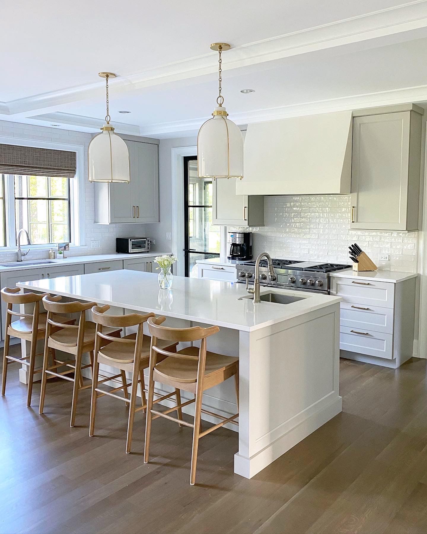 There is a large island in the middle of the kitchen.