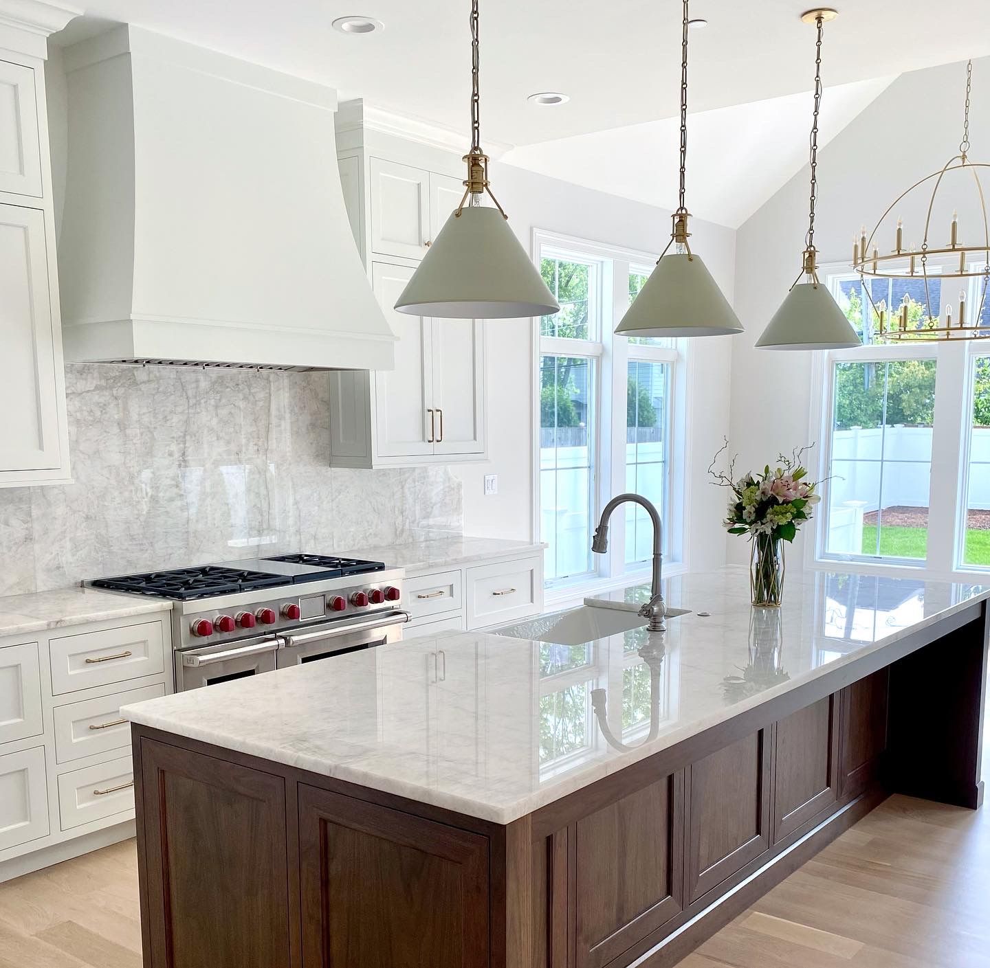 A kitchen with a large island and a sink