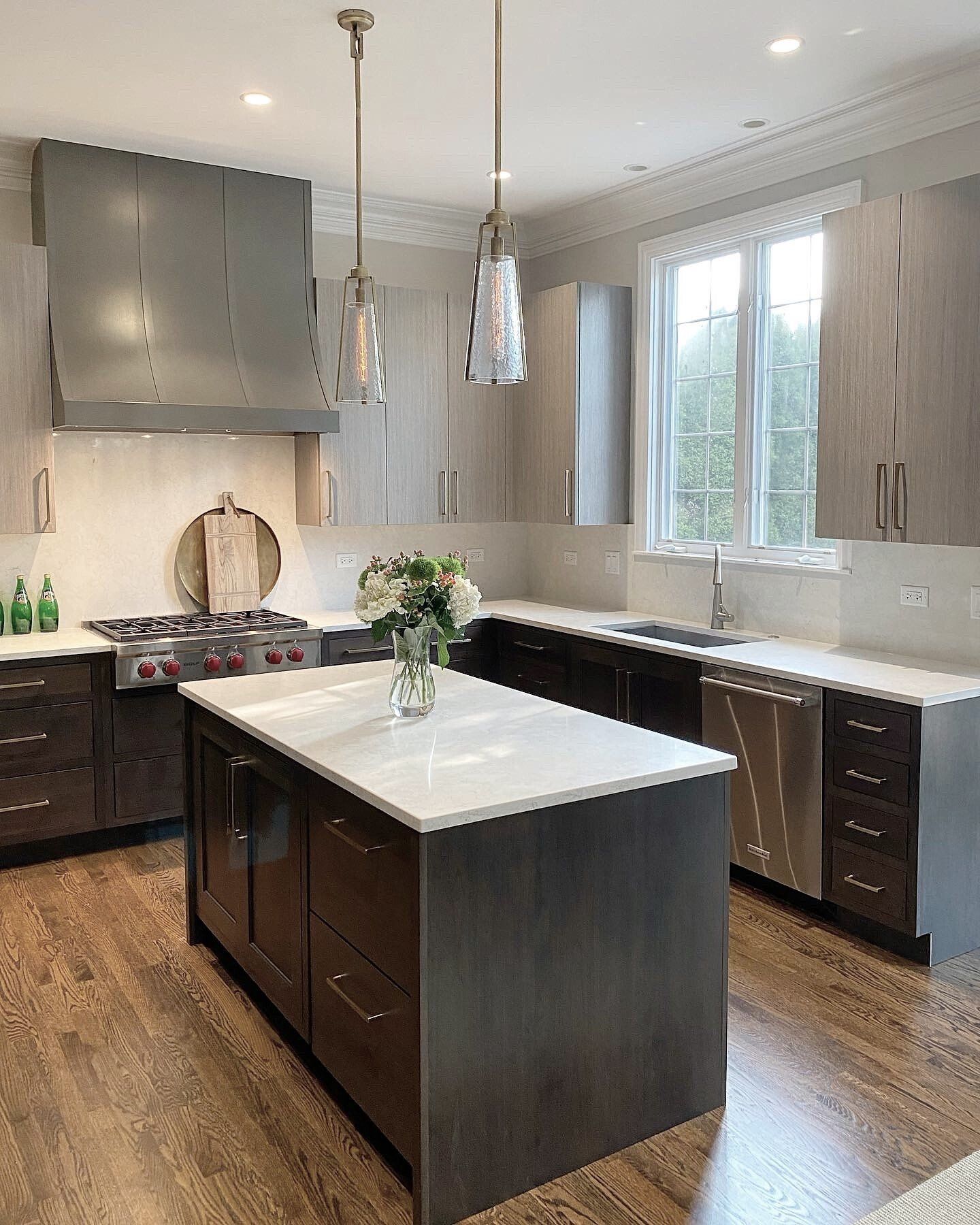 A kitchen with a large island in the middle of it