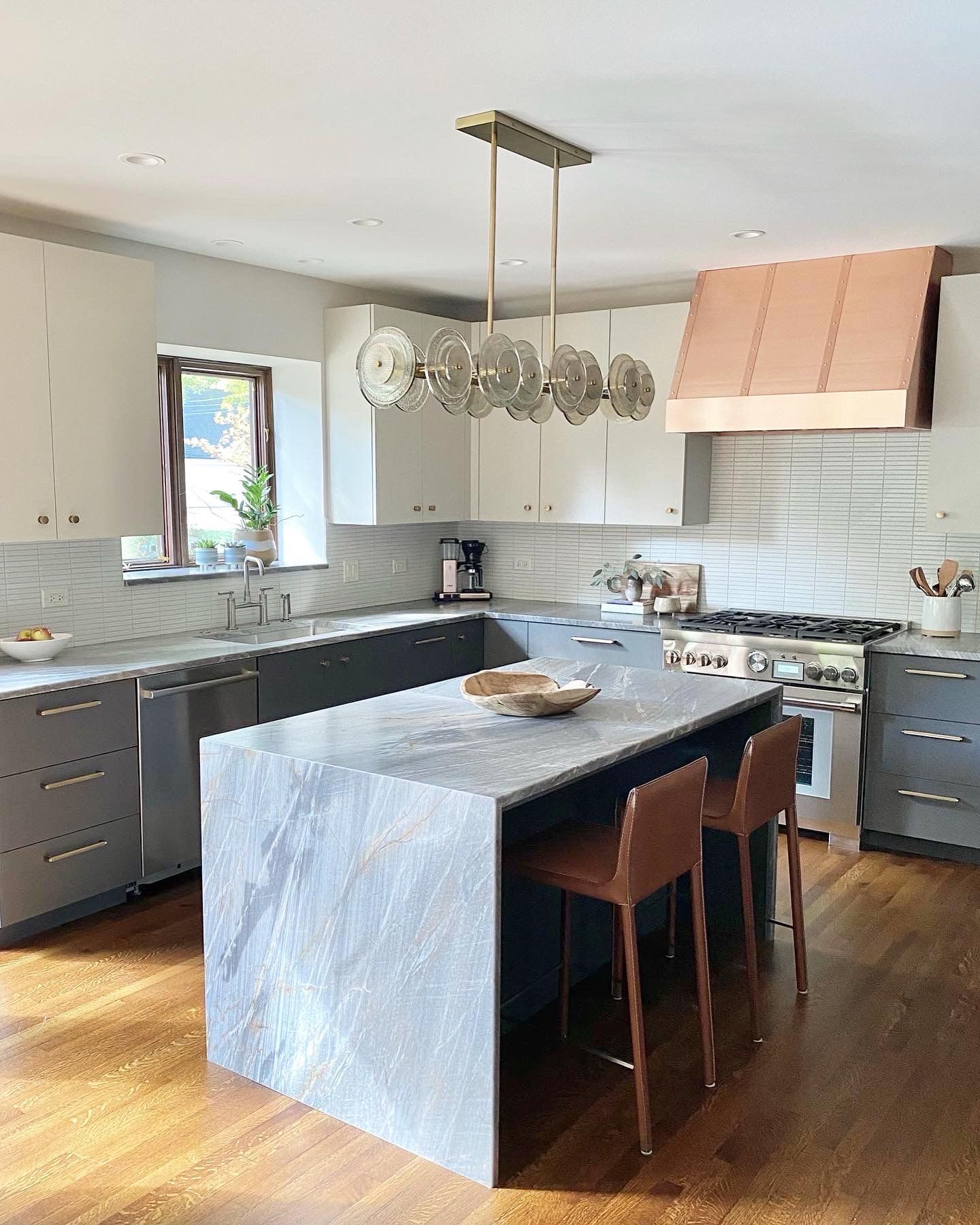 There is a large island in the middle of the kitchen.