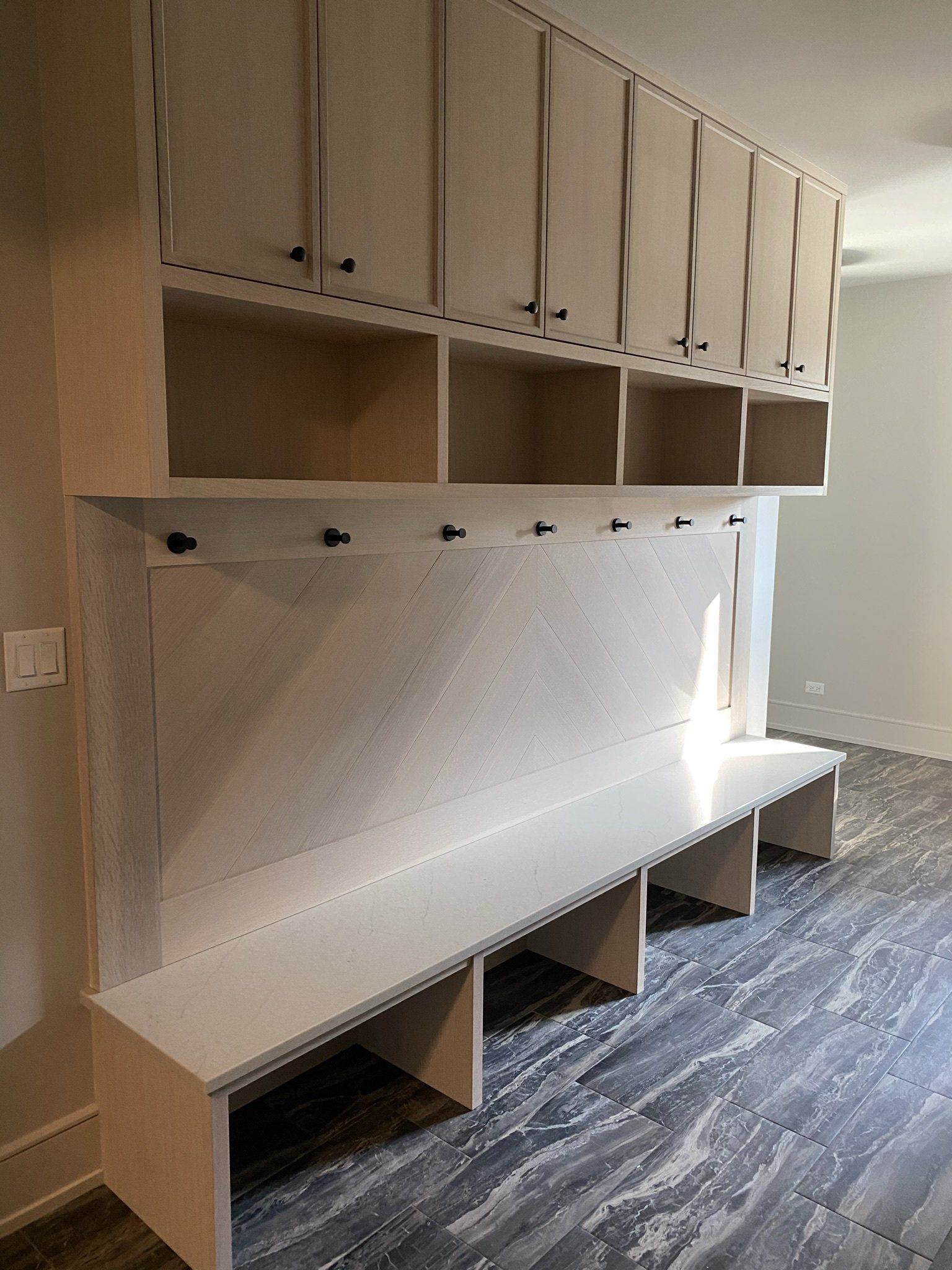 There is a bench in the middle of the room.