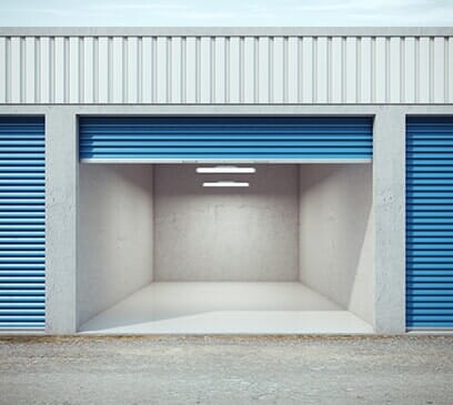 An open door of an empty storage unit.