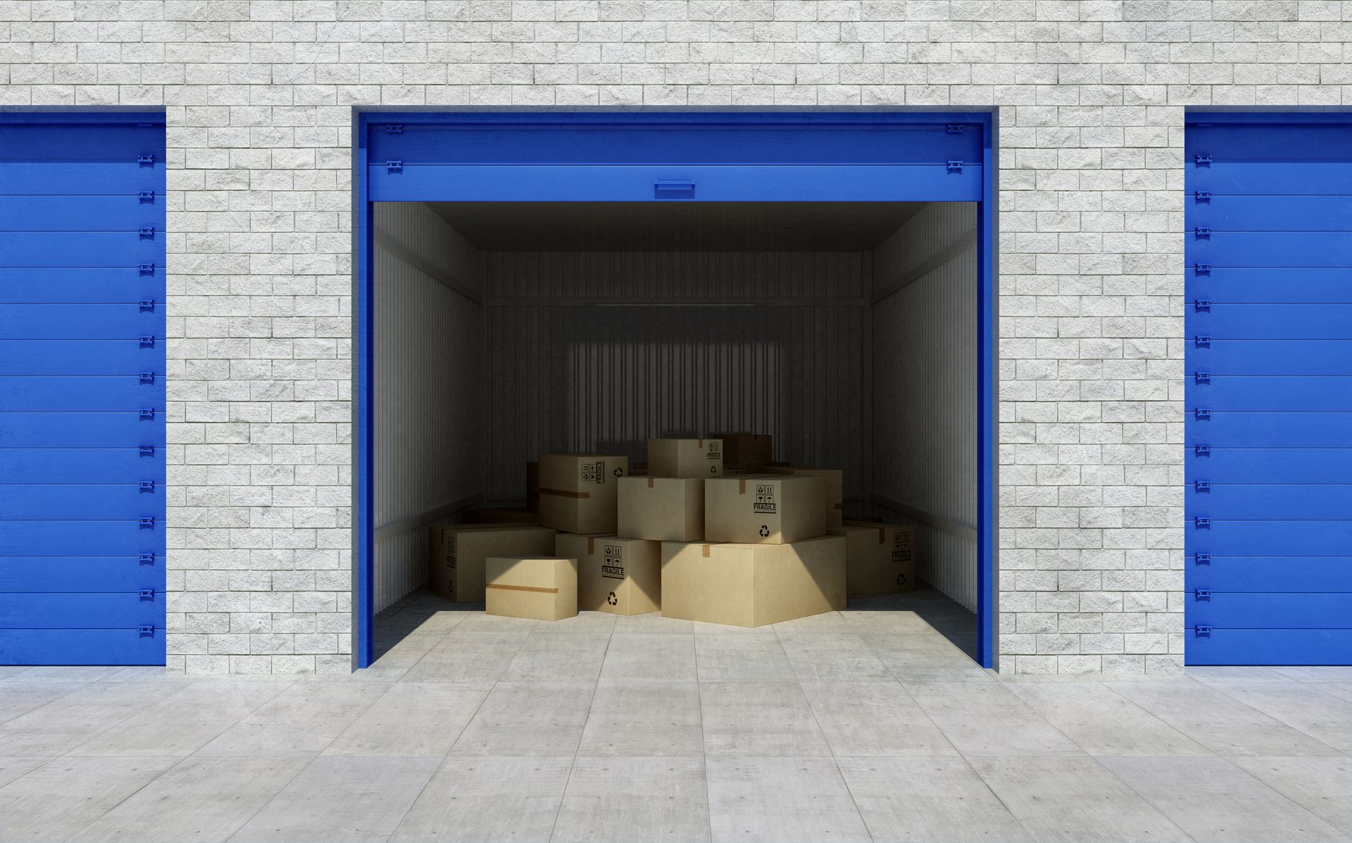 Open self-storage facility unit filled with cardboard boxes for secure personal storage.