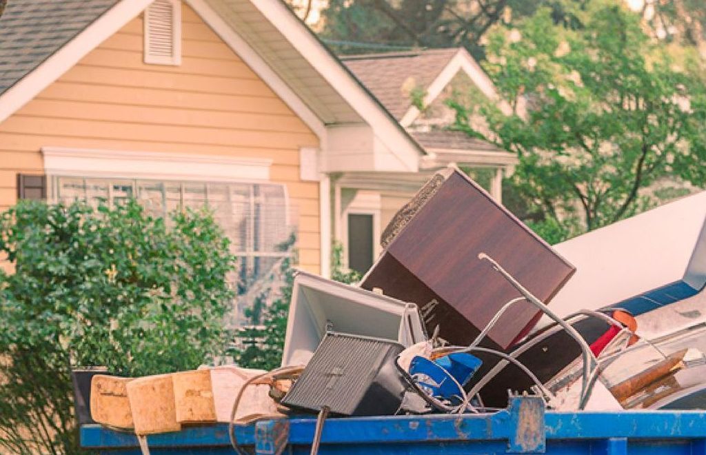 Residential waste dumpster rental setup in a neighborhood in Granbury, TX