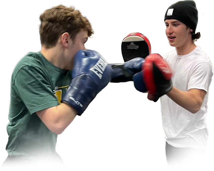 Two men wearing everlast boxing gloves are sparring