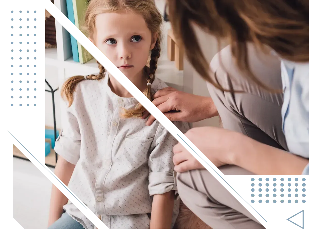 little girl looking concerned at her mother for guidance on her mental health