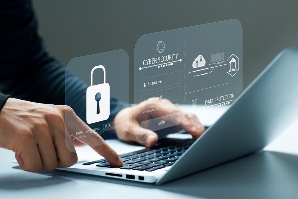 A person is using a laptop computer with a padlock on the screen.