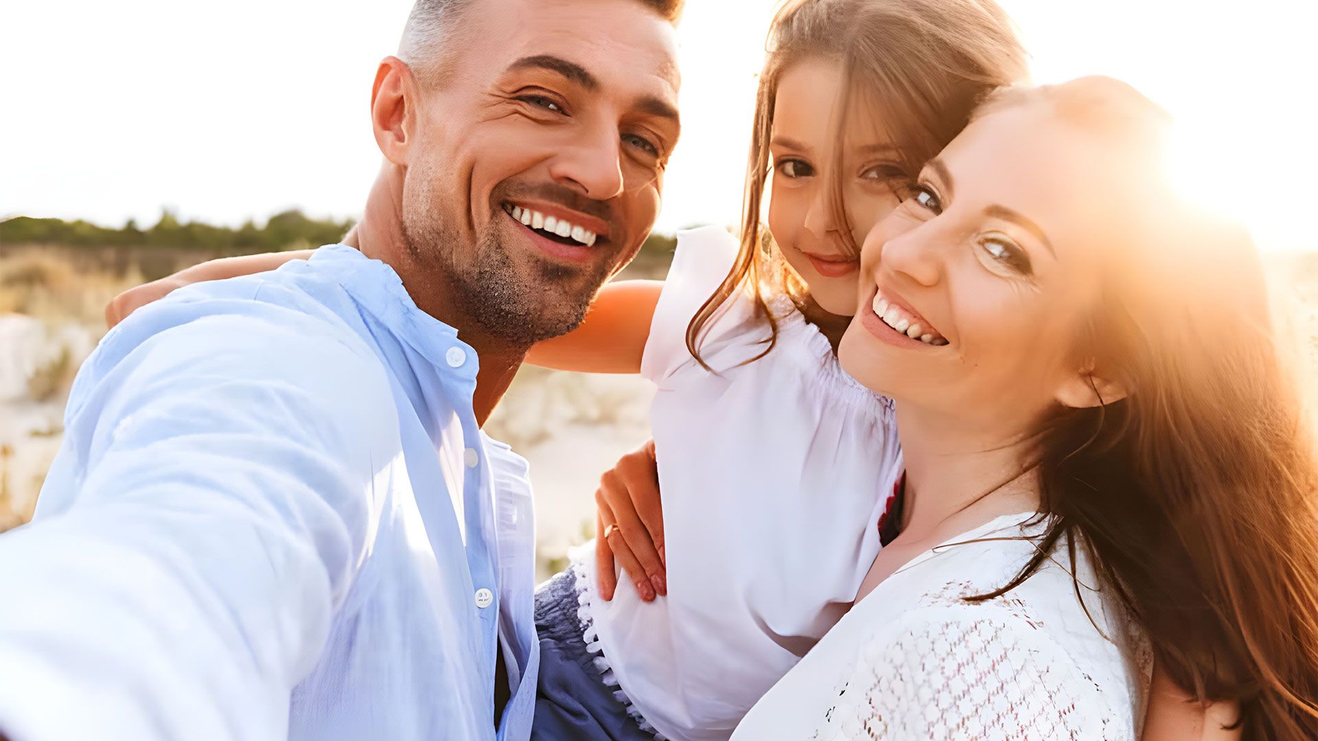 A family is taking a selfie on the beach — Coast & Country Insurance Consultants Pty Ltd In Central Coast, NSW