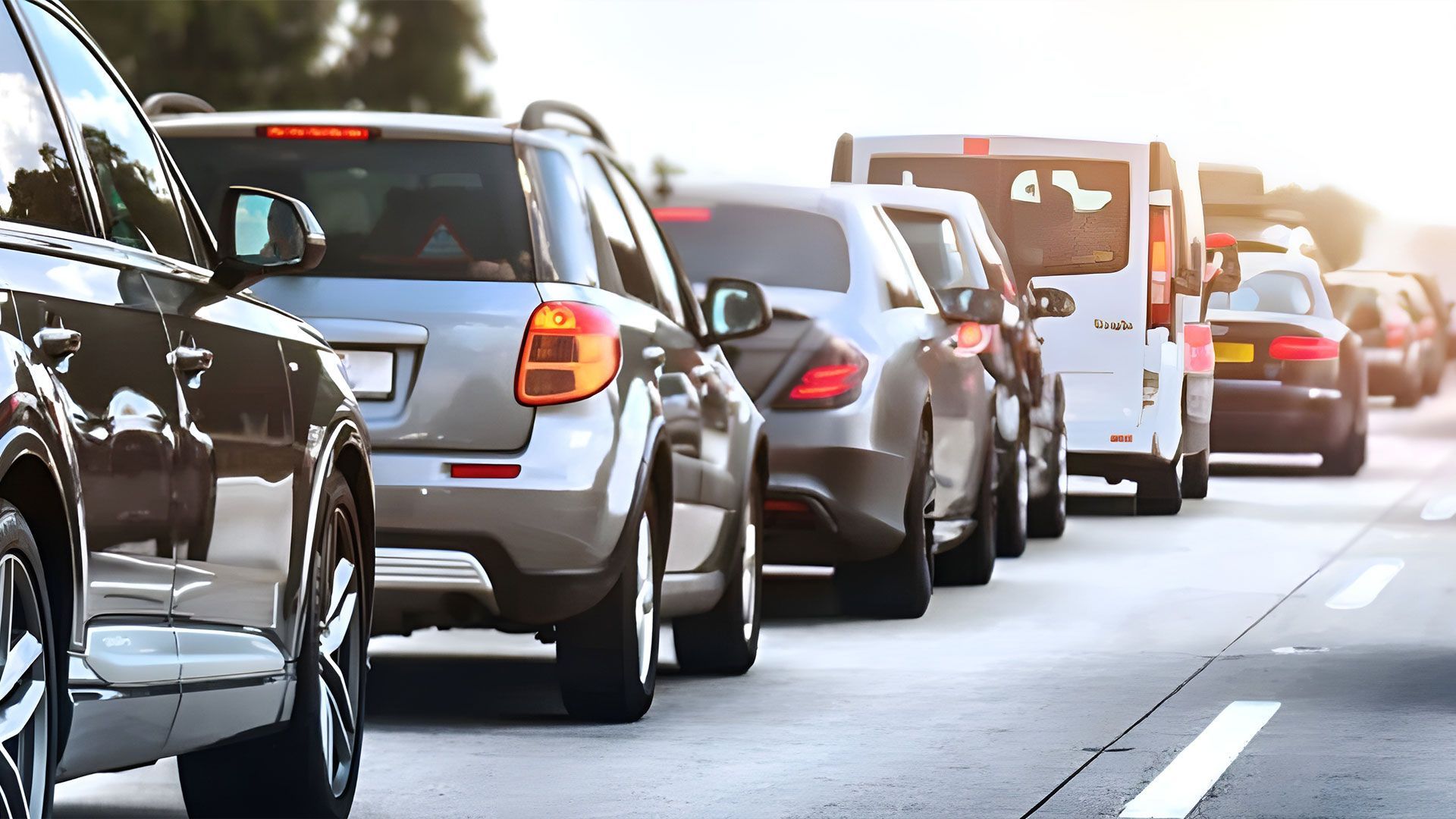 A Row Of Cars Are Parked In A Parking Lot — Coast & Country Insurance Consultants Pty Ltd In Central Coast, NSW