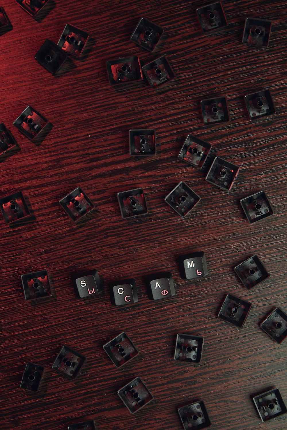 a Bunch of Keyboard Keys Are Laying on a Wooden Table — Coast & Country Insurance Consultants Pty Ltd In Central Coast, NSW
