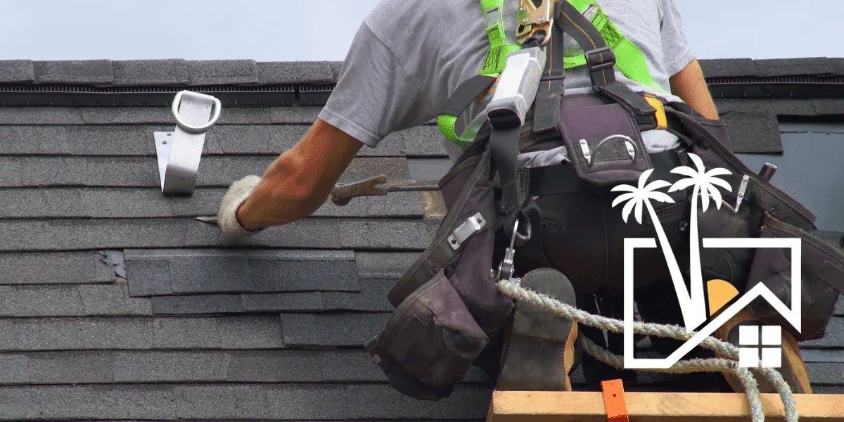 A construction worker repairs a roof, wearing safety gear. A construction worker repairs a roof, wearing safety gear.