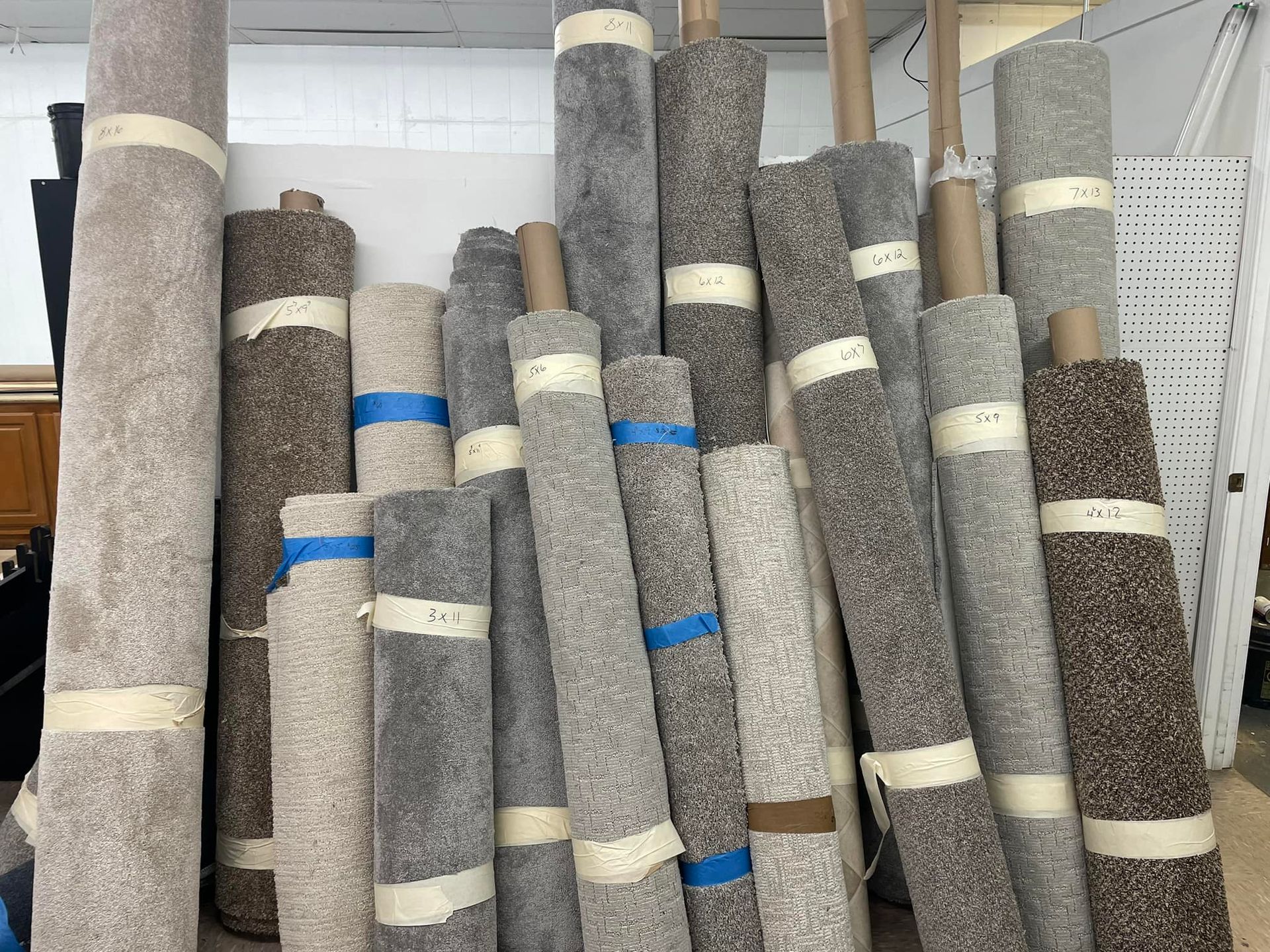 A bunch of rolls of carpet are stacked on top of each other