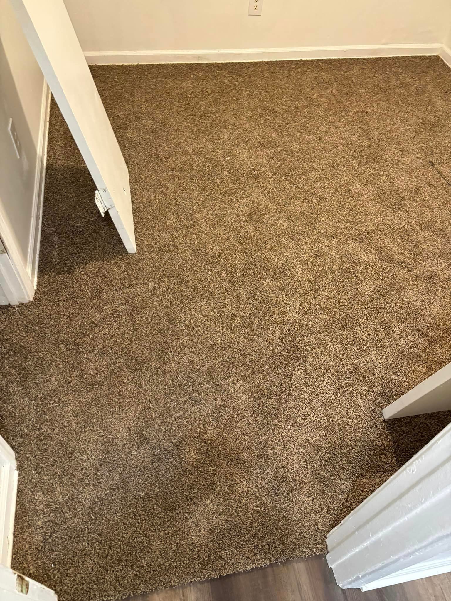 A bunch of rolls of carpet are stacked on top of each other