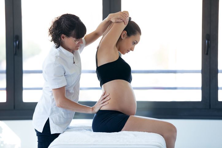 A person is getting acupuncture on their back.