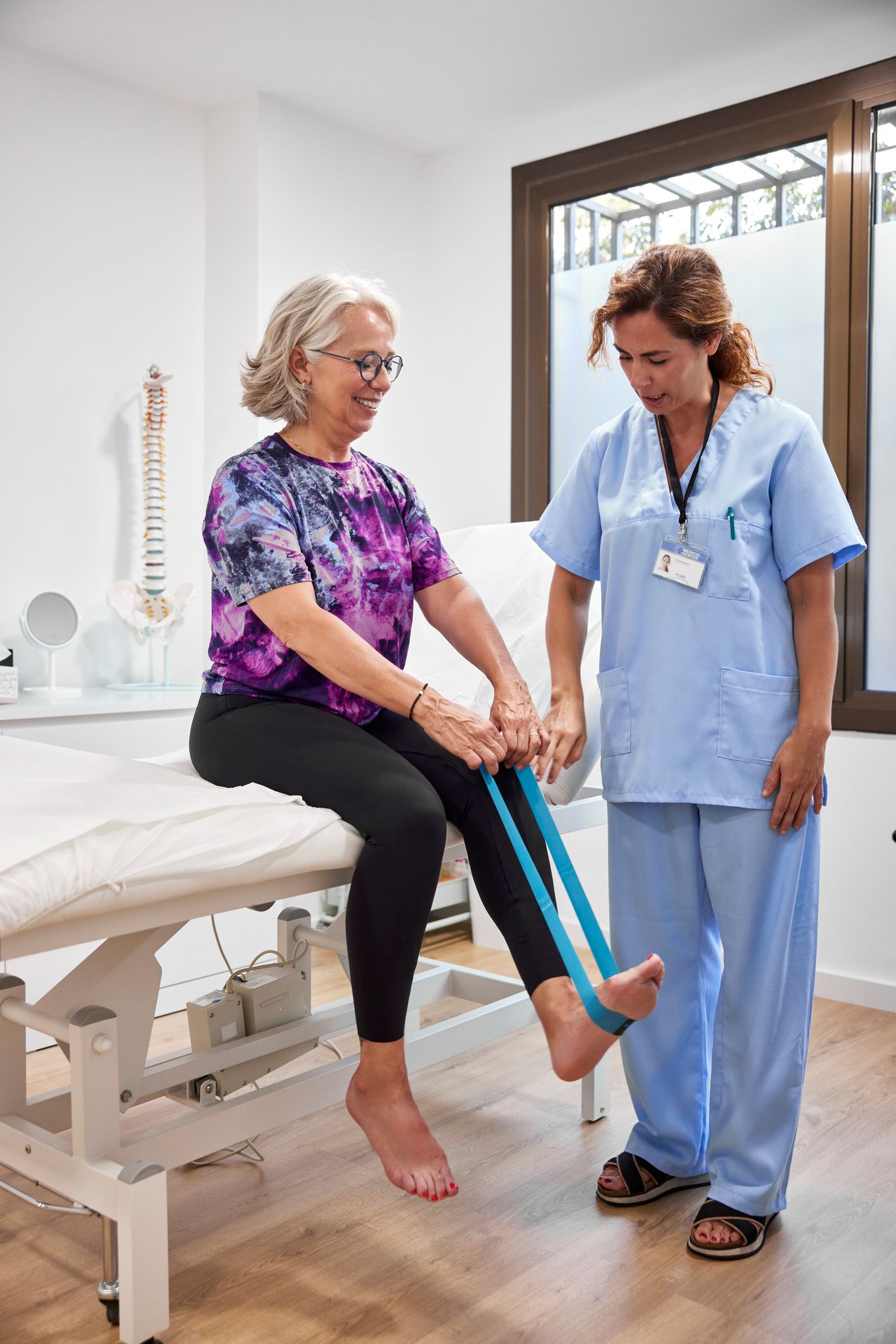A man is getting his knee examined by a doctor.
