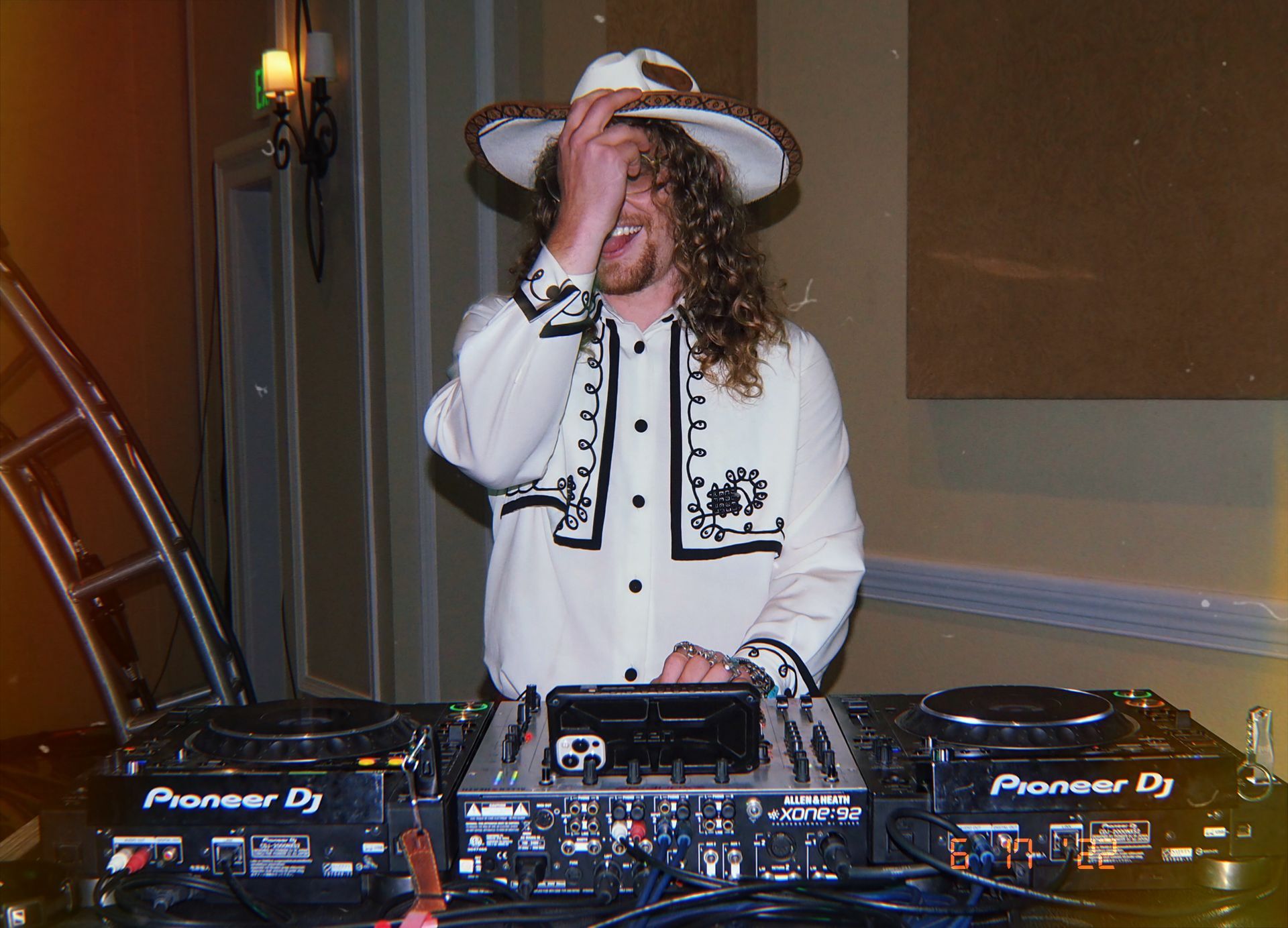 Corporate DJ in cowboy hat works the camera at event for BTL Aesthetics in orange county california. 