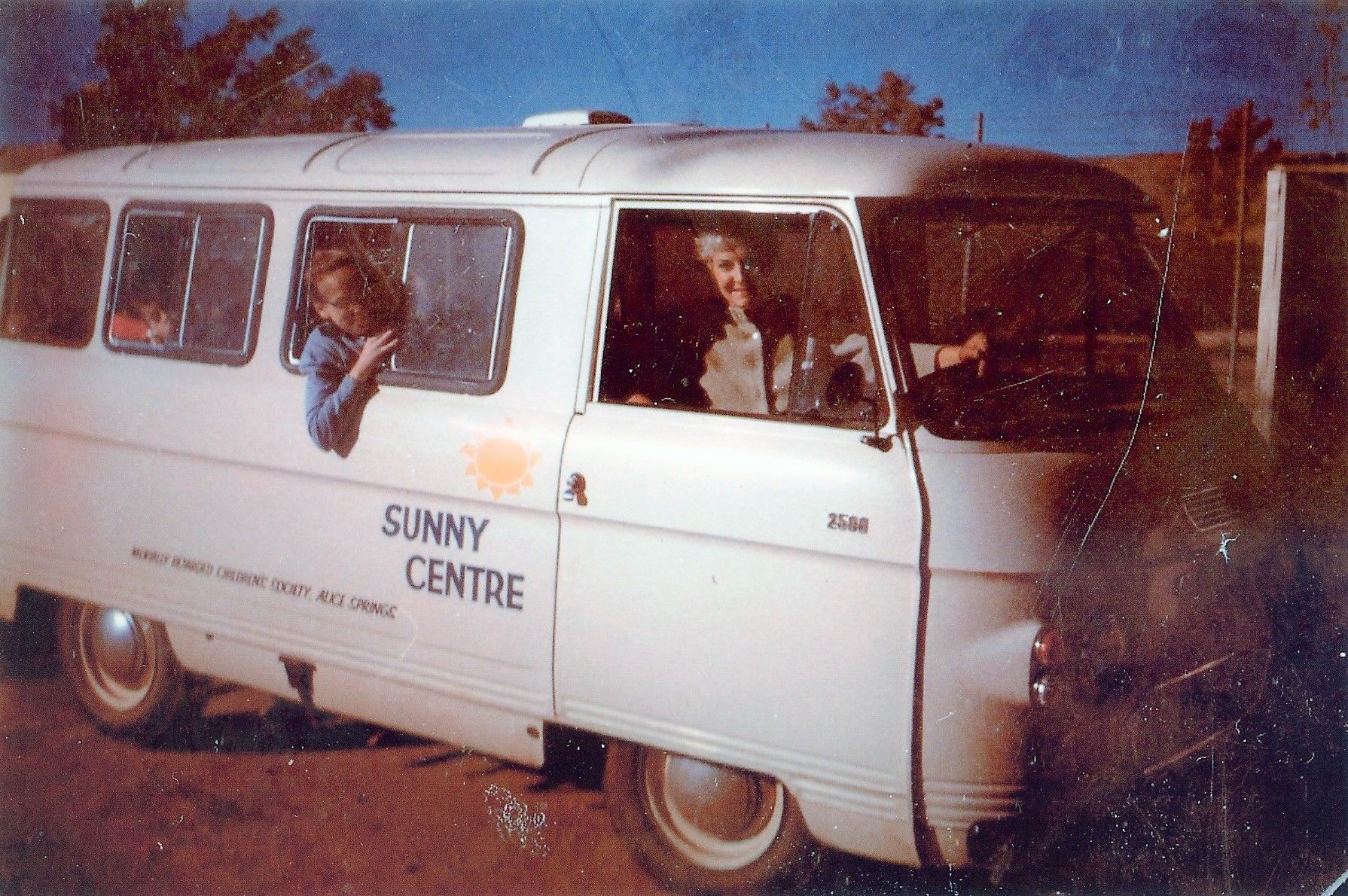 A white van that says sunny centre on the side