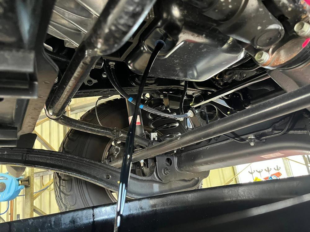 Inspecting A Car Under — KBX Mechanical In West Mackay, QLD